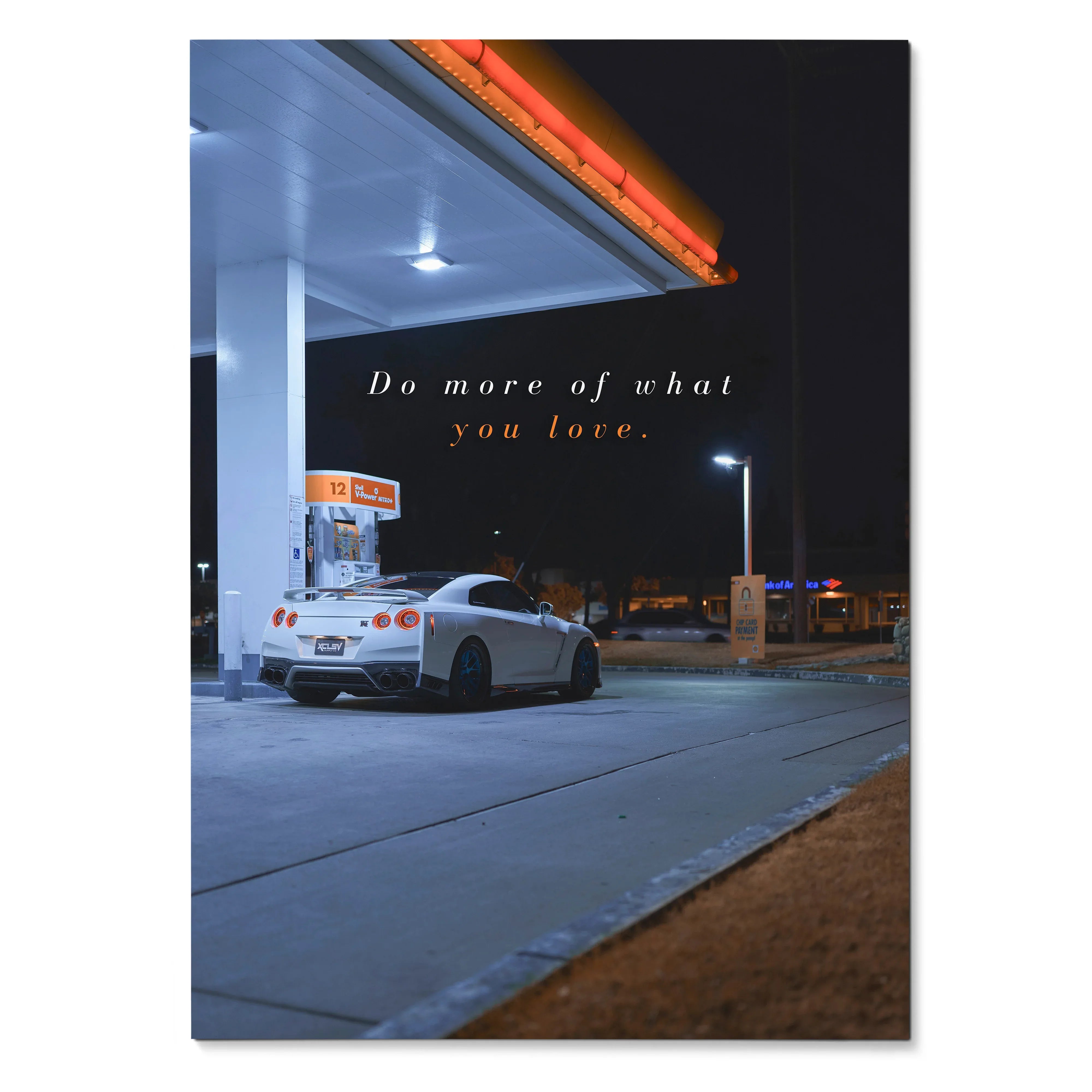Poster wall art featuring a white Nissan R35 GT-R at a gas station at night with motivational text.