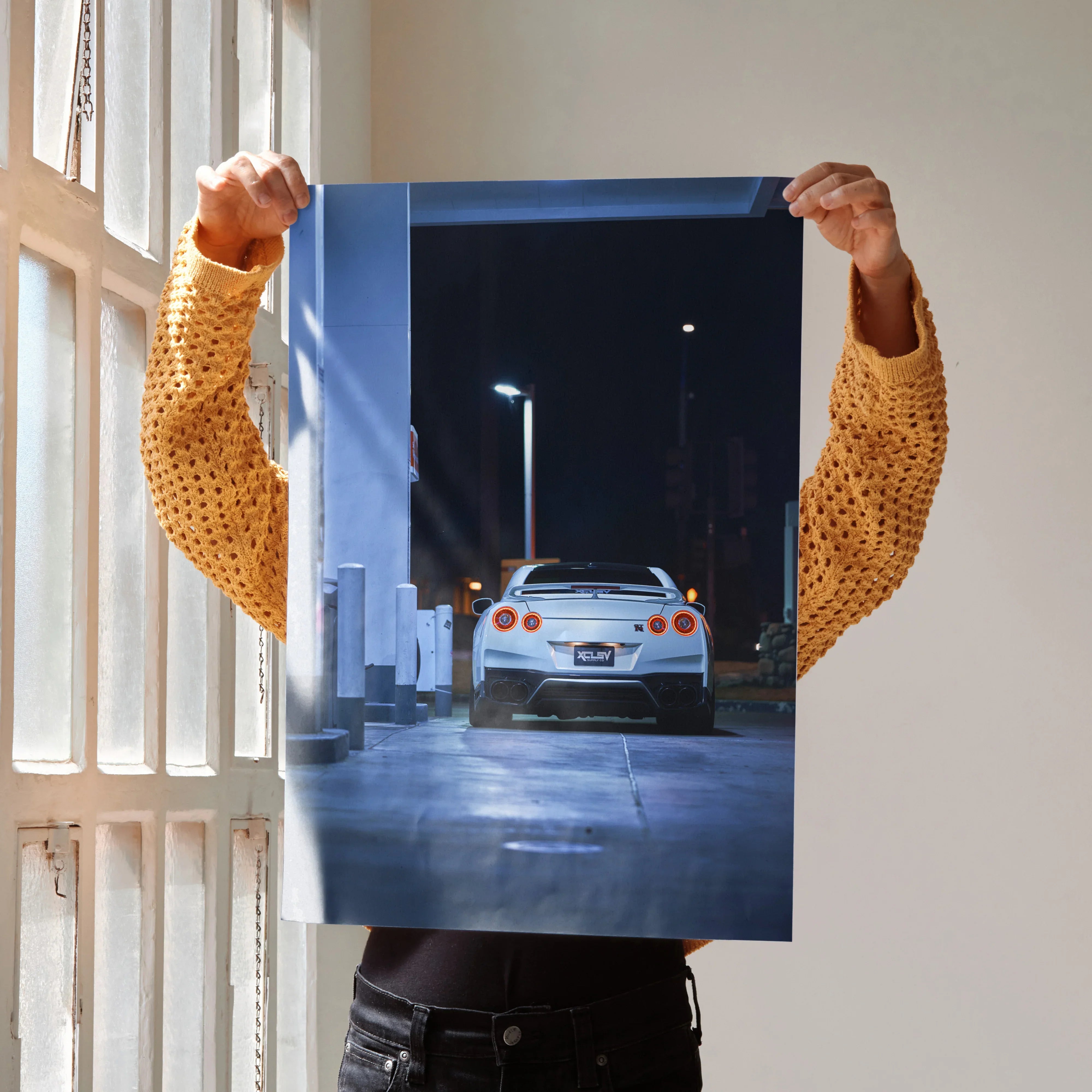 Nissan GTR R35 rear view poster with night city street wall art in blue tones.