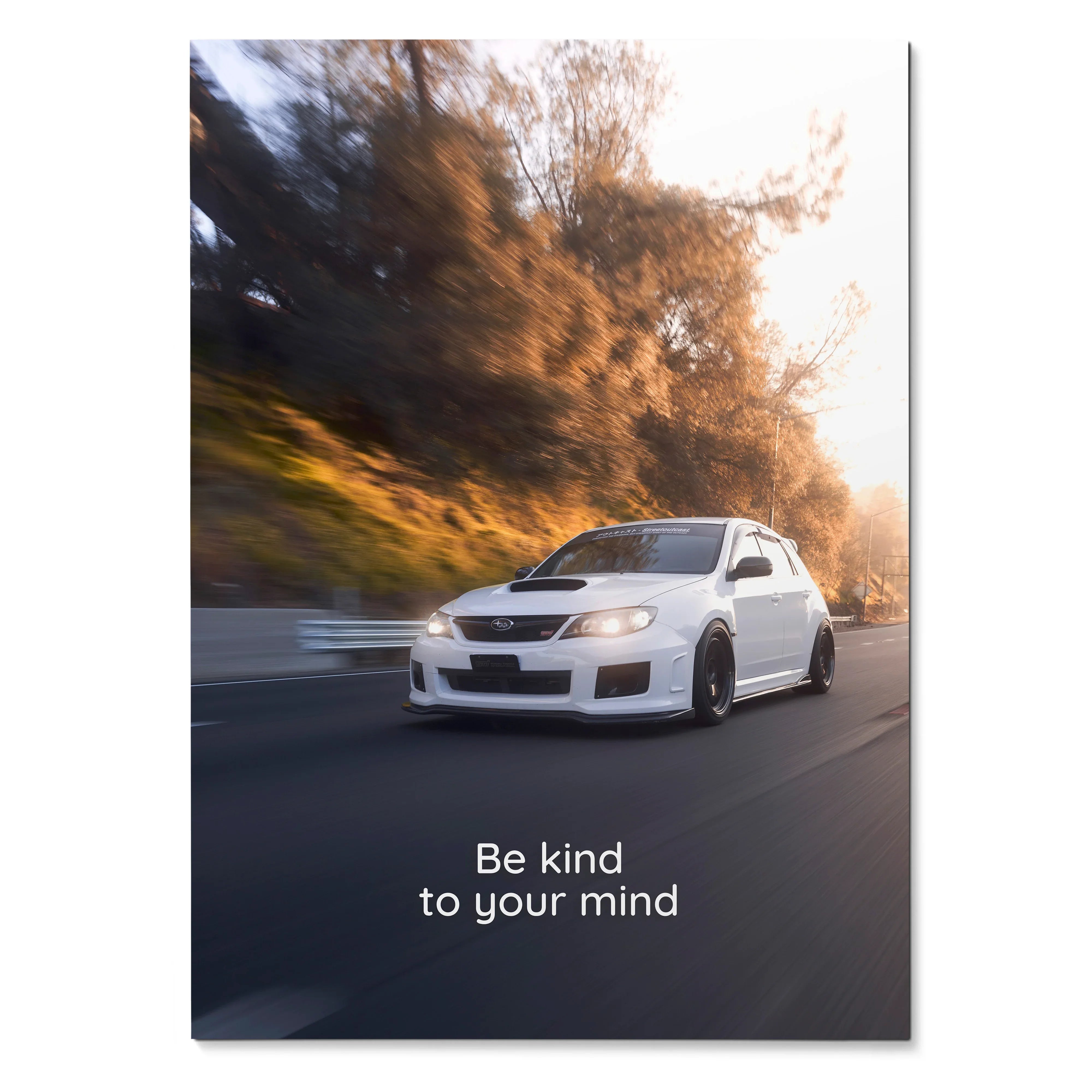 Subaru WRX STI driving on road with "Be kind to your mind" motivational text poster wall art.