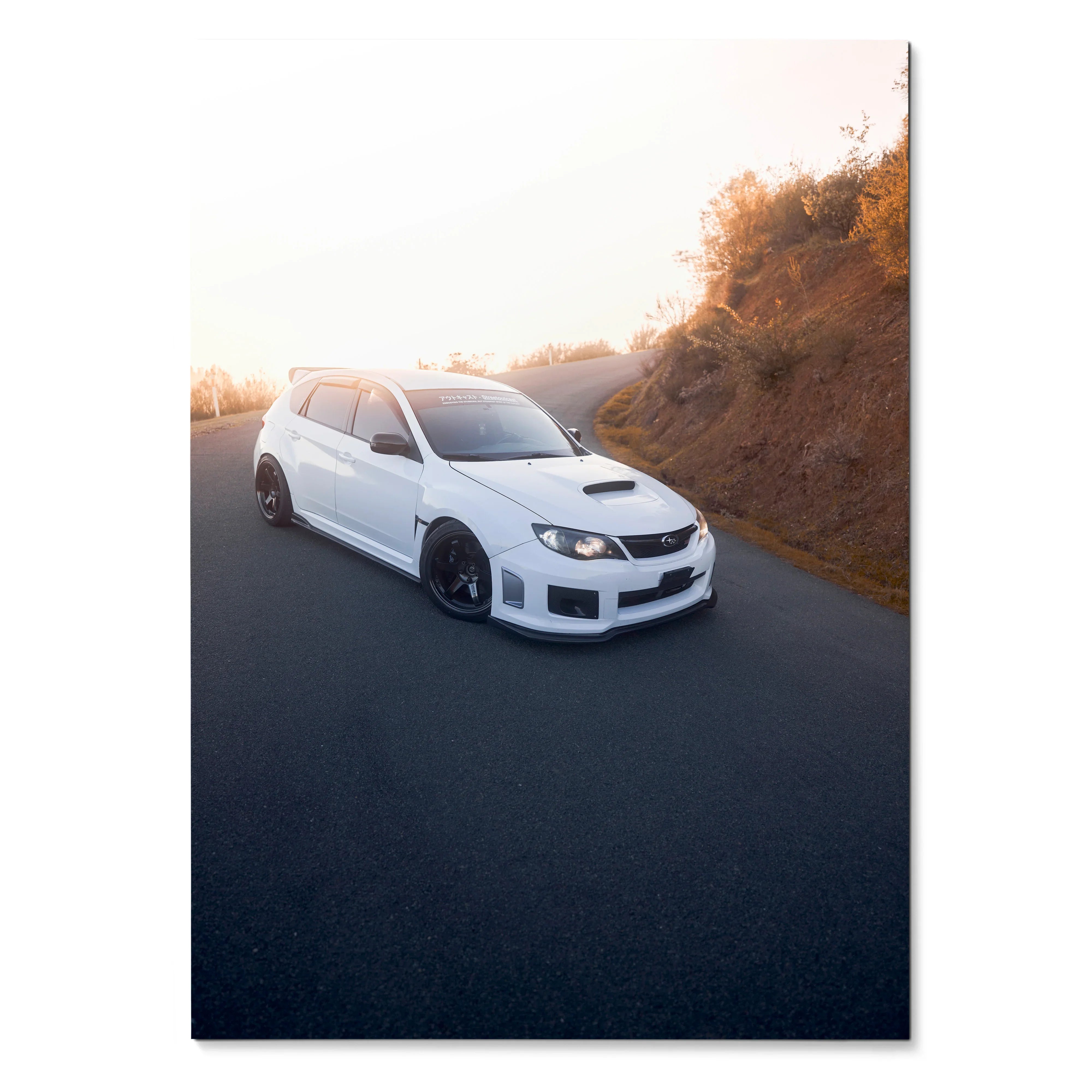 White Subaru WRX STI parked on road at sunset poster wall art.