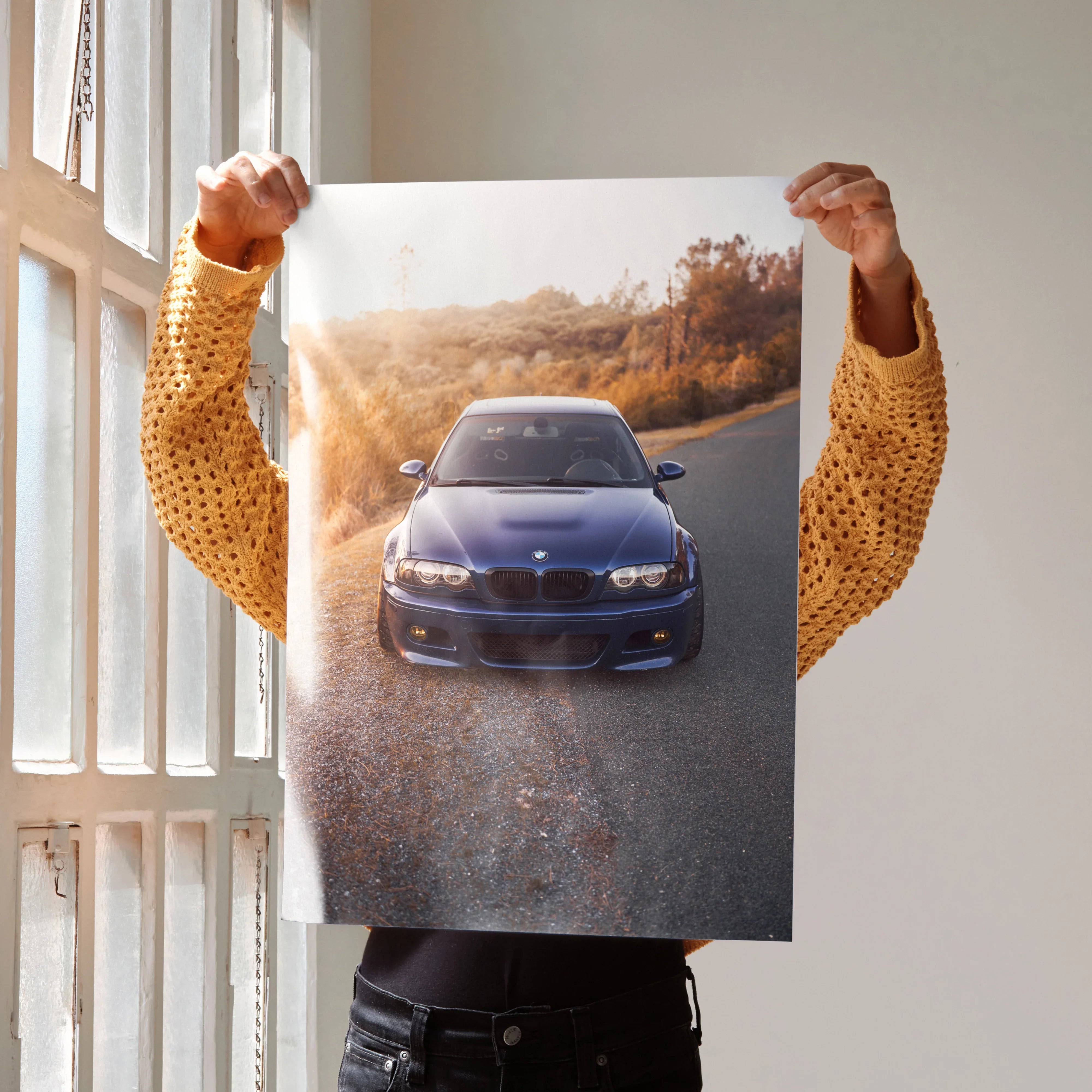 BMW E46 M3 front view poster showcasing iconic car on scenic road, automotive wall art.