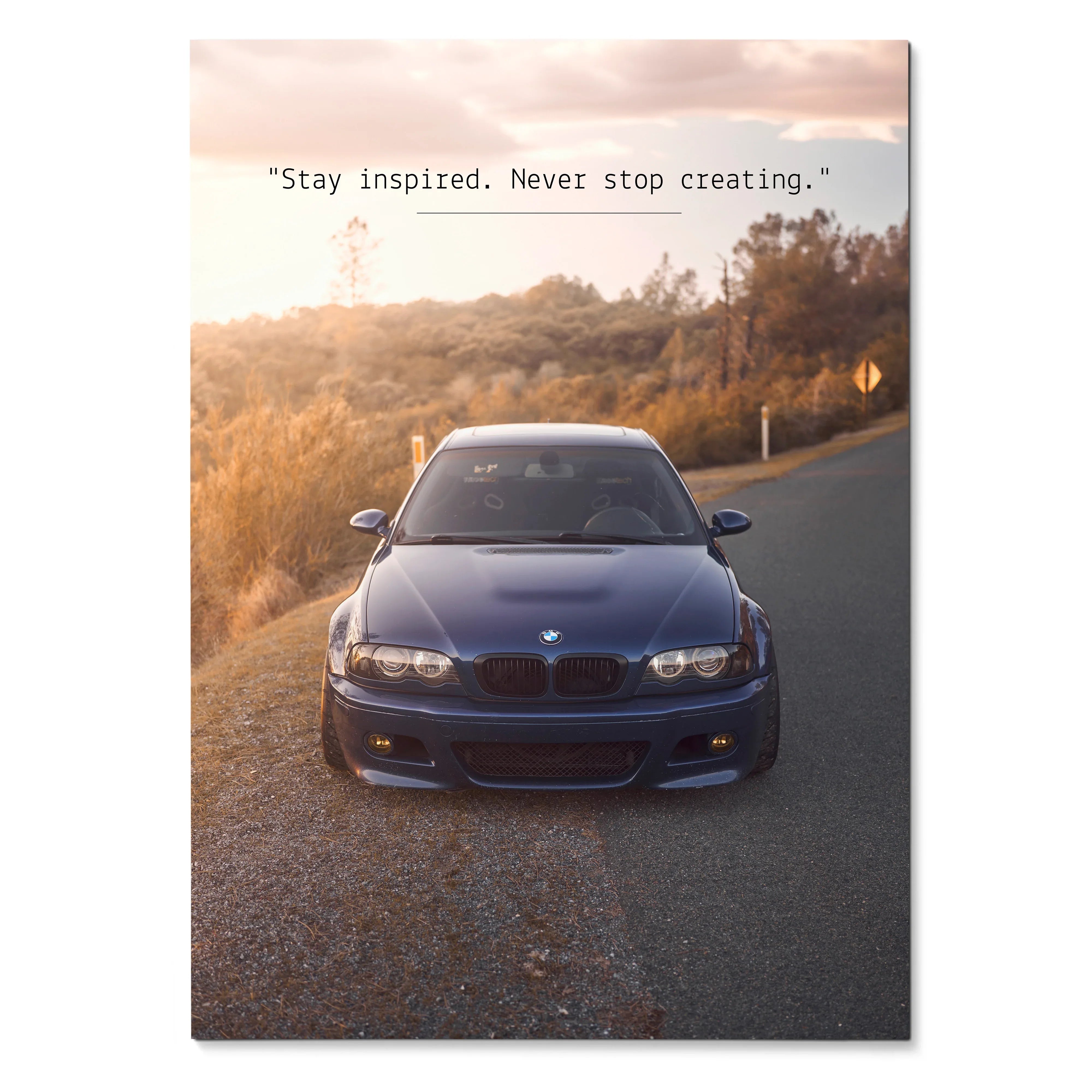 BMW E46 M3 driving on road at sunset with motivational text poster wall art.