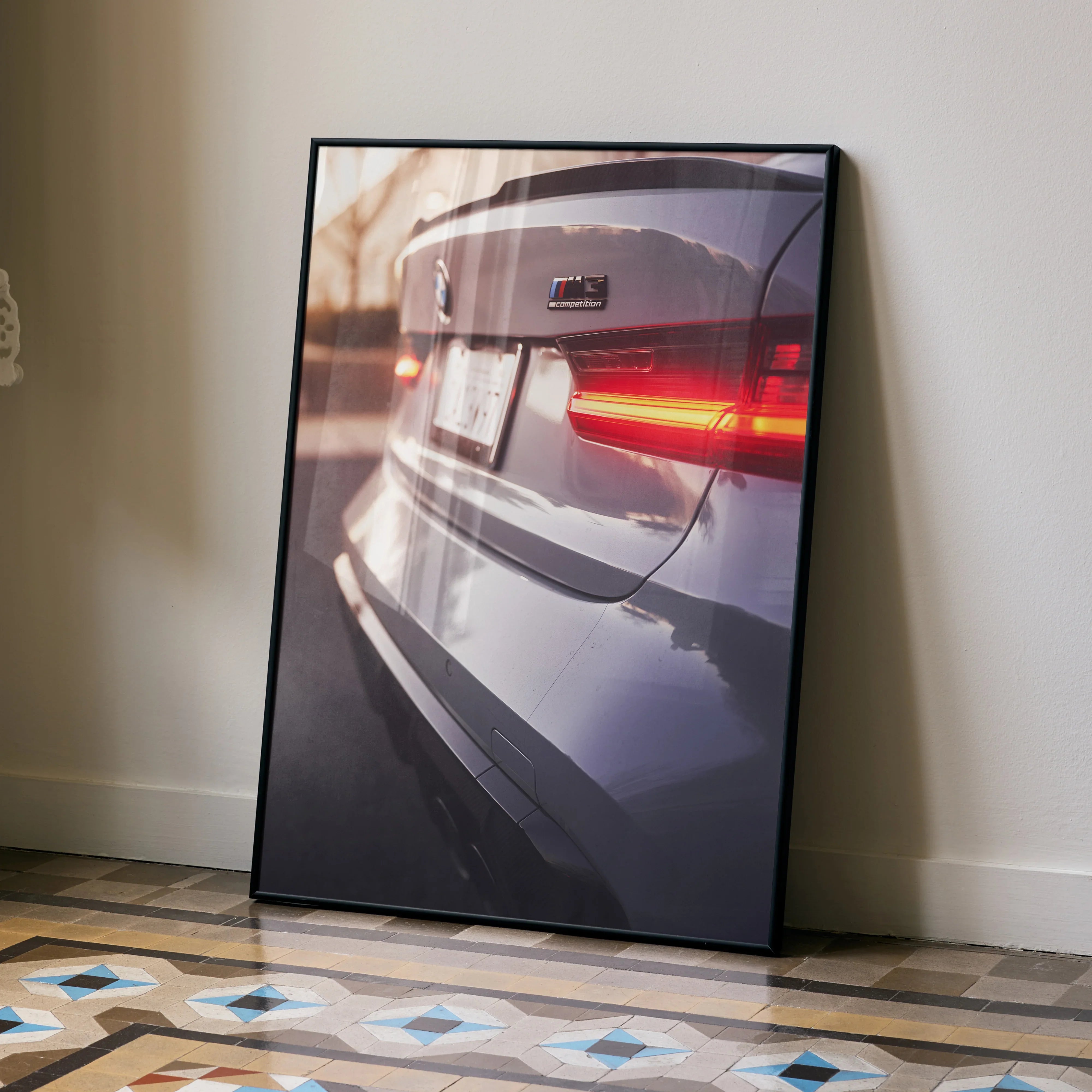 BMW G80 M3 rear close-up poster with glowing taillights in sleek black frame wall art.