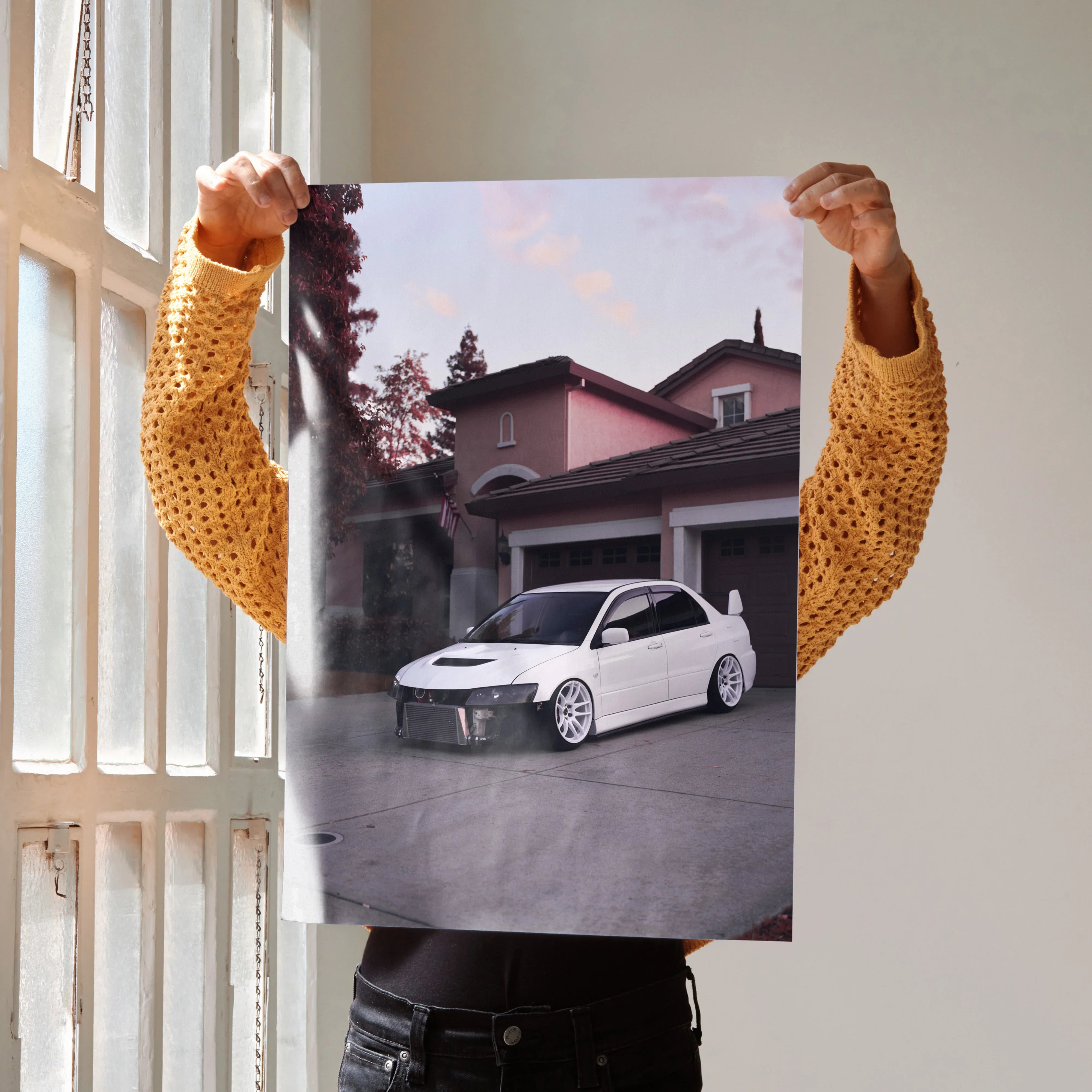 Mitsubishi Evo 8 poster wall art featuring white car in driveway against house backdrop.