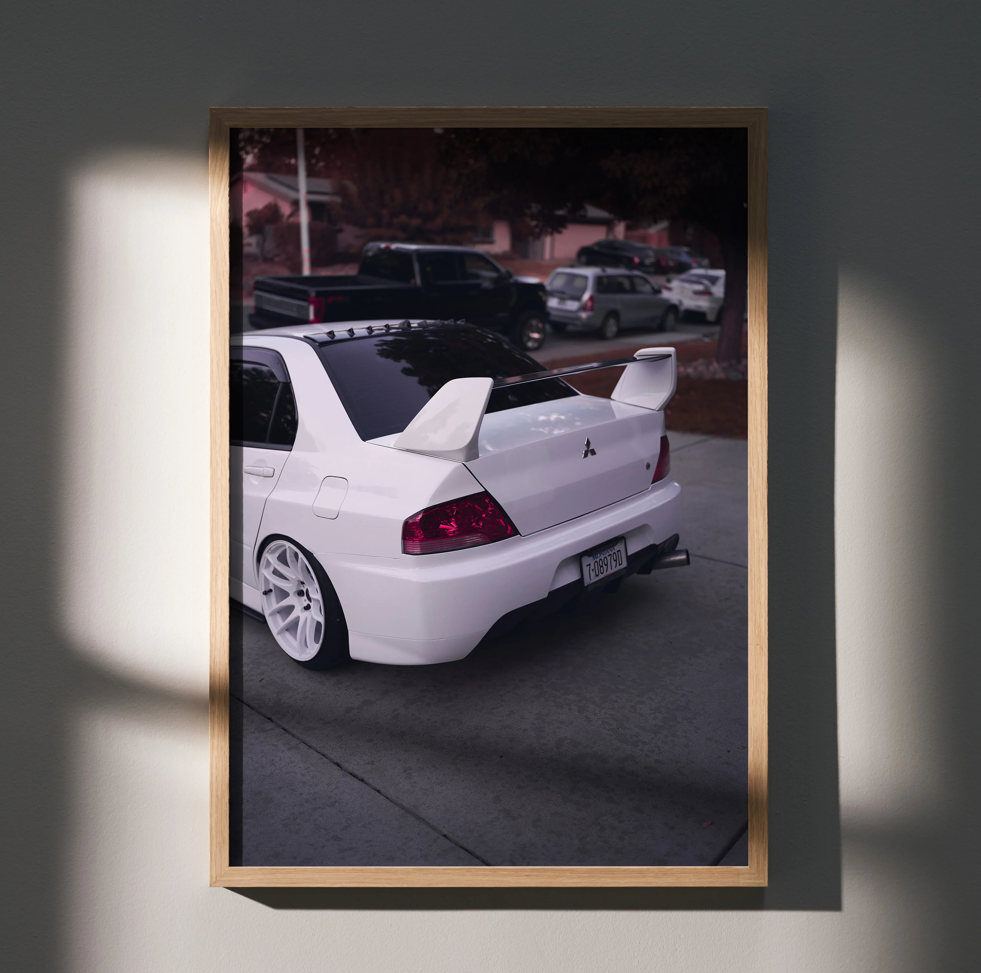 Mitsubishi Evo 8 rear view poster with white car and large spoiler, automotive wall art.