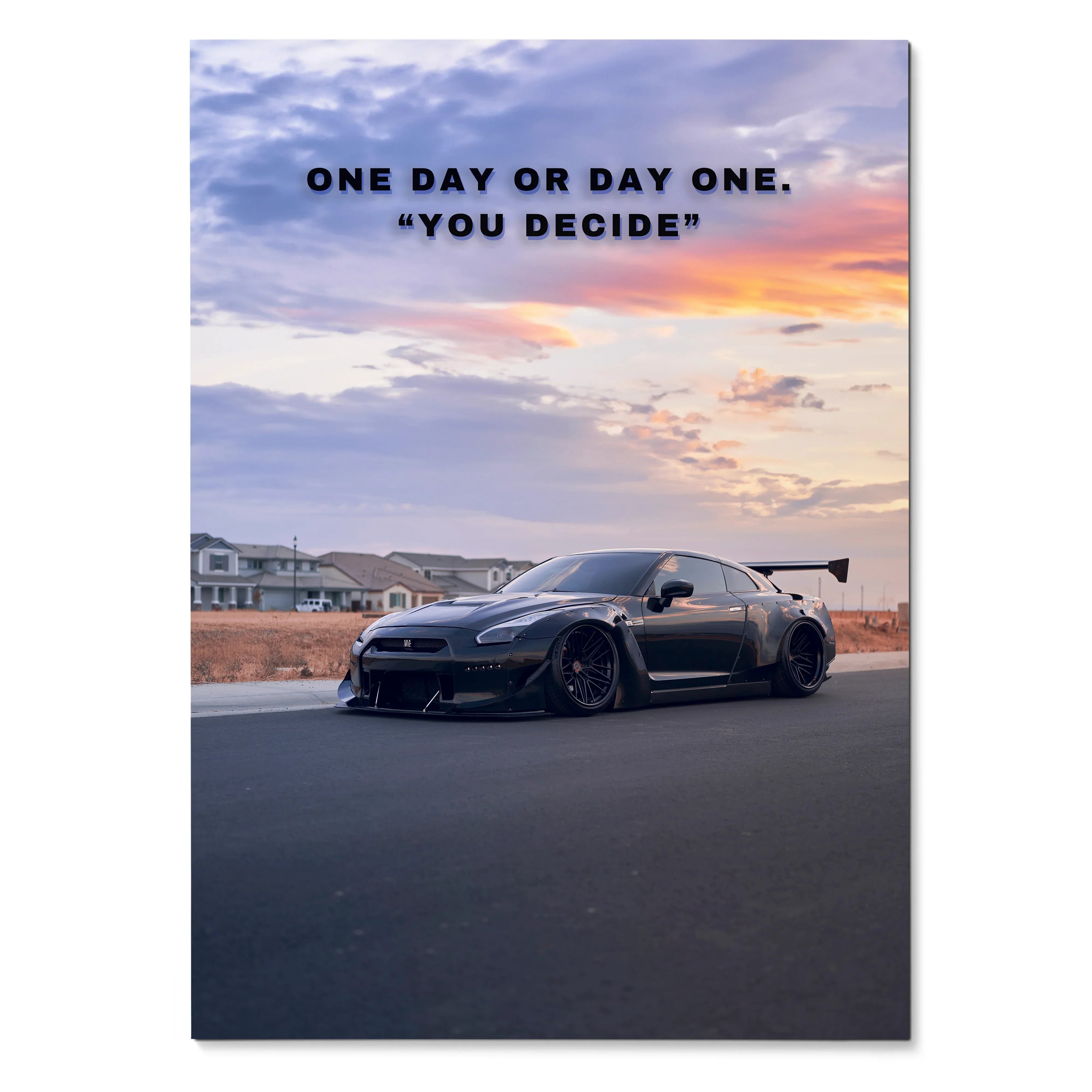 Motivational poster wall art featuring black Nissan R35 GT-R on road under colorful sunset sky with inspiring text.