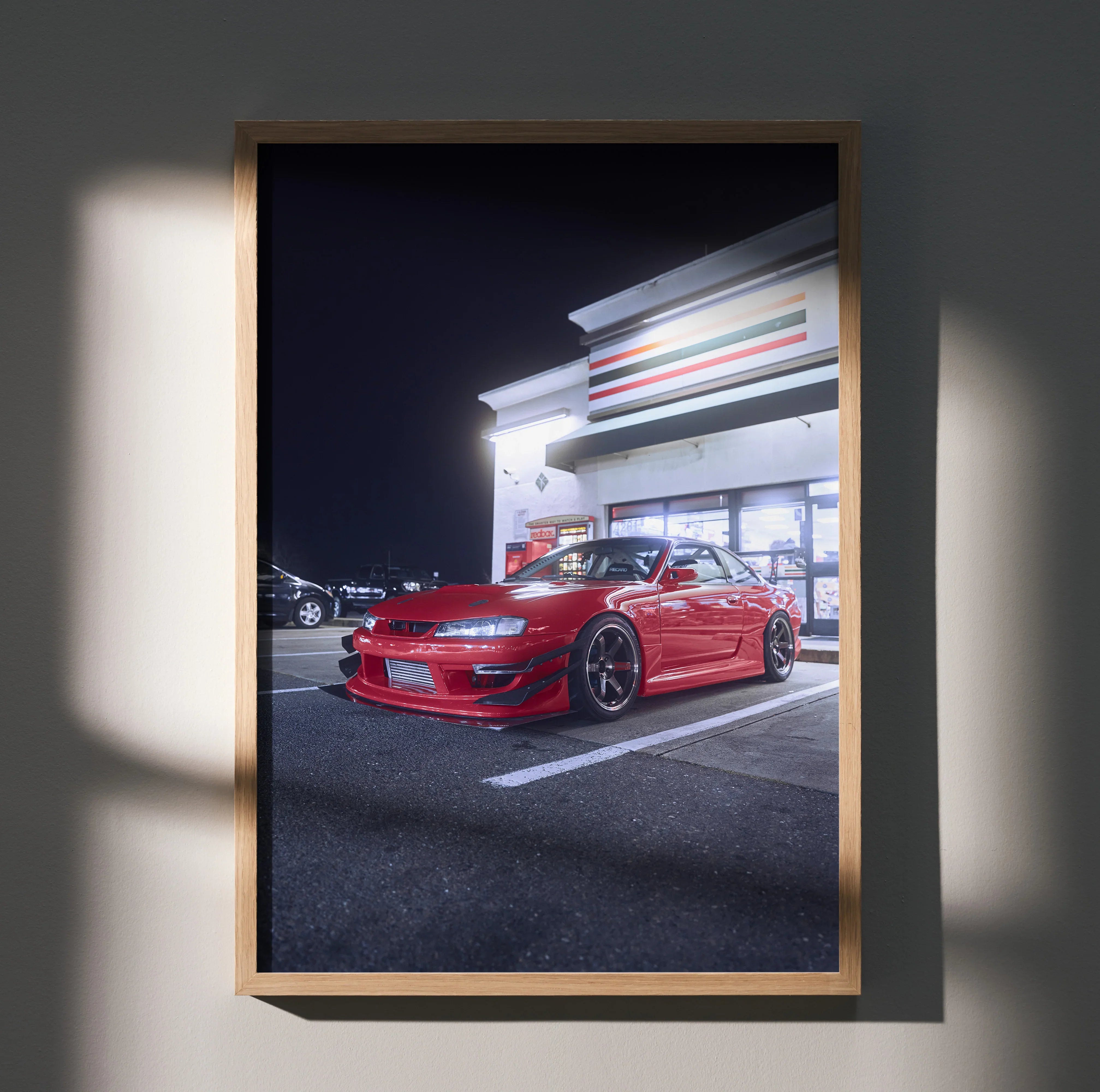 Nissan 240sx S14 Kouki poster featuring red car in front of illuminated 7-Eleven store wall art.