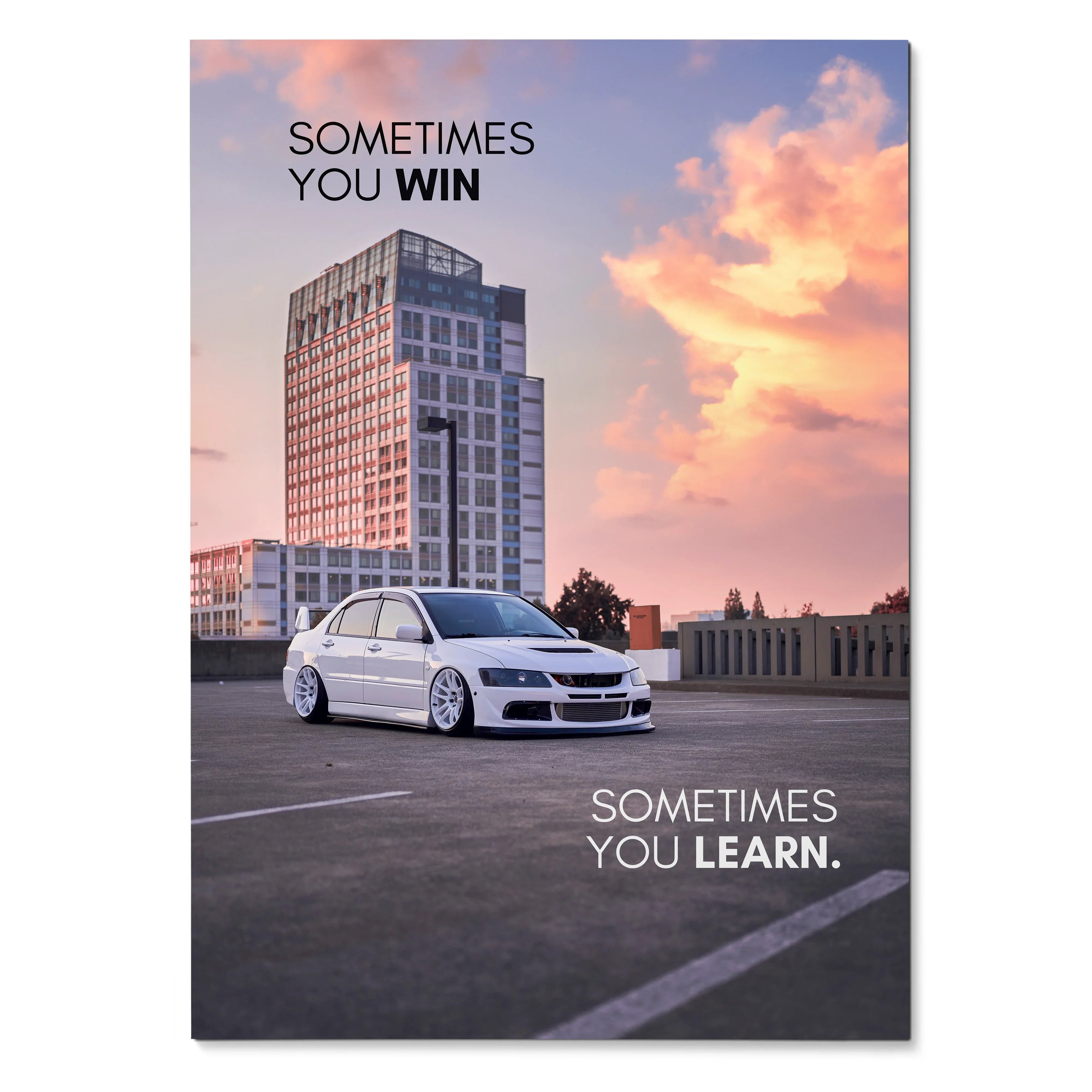 Motivational poster featuring white Mitsubishi Evo 8 with inspiring text against a sunset sky wall art.