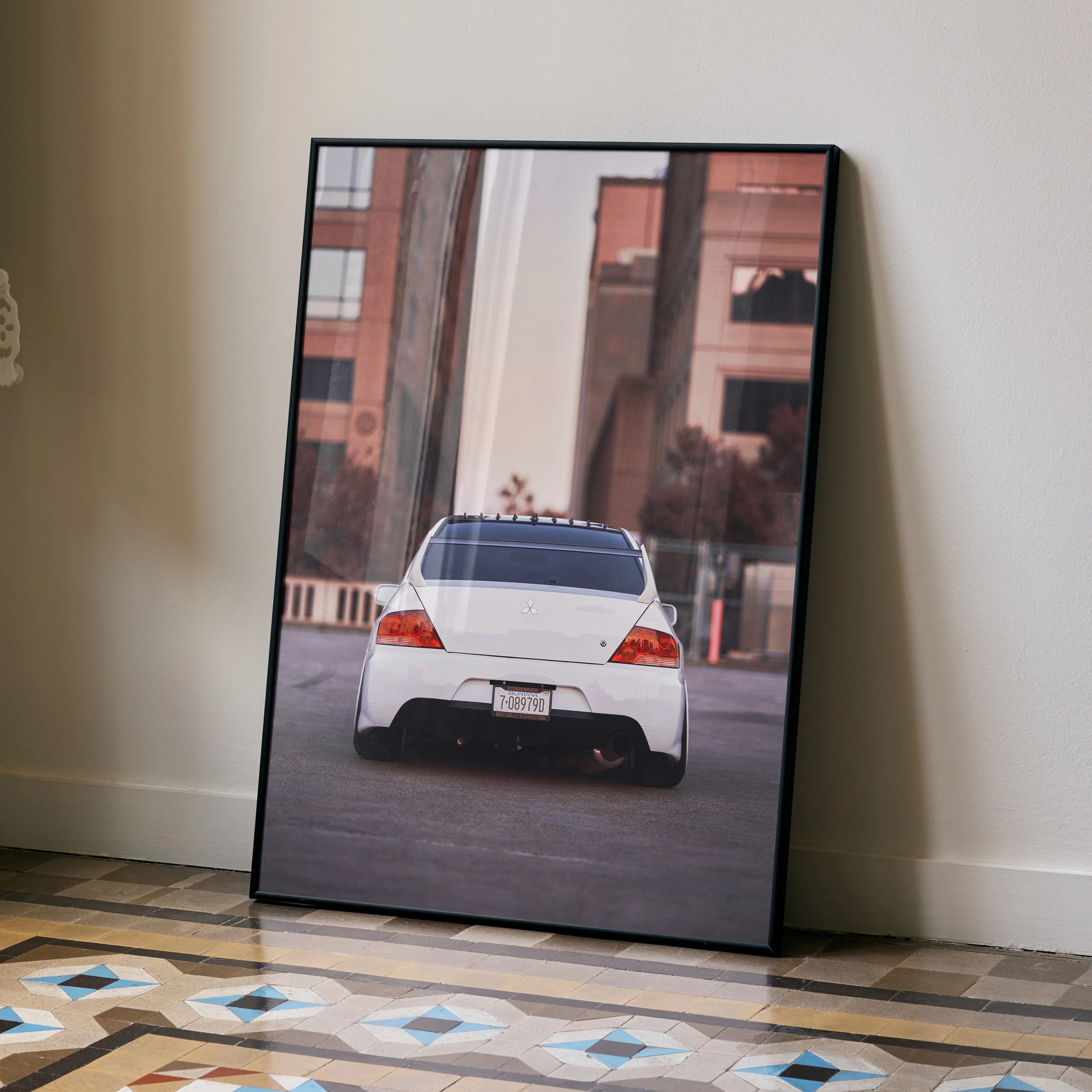 Mitsubishi Evo 8 rear view poster displayed as modern wall art in black frame.