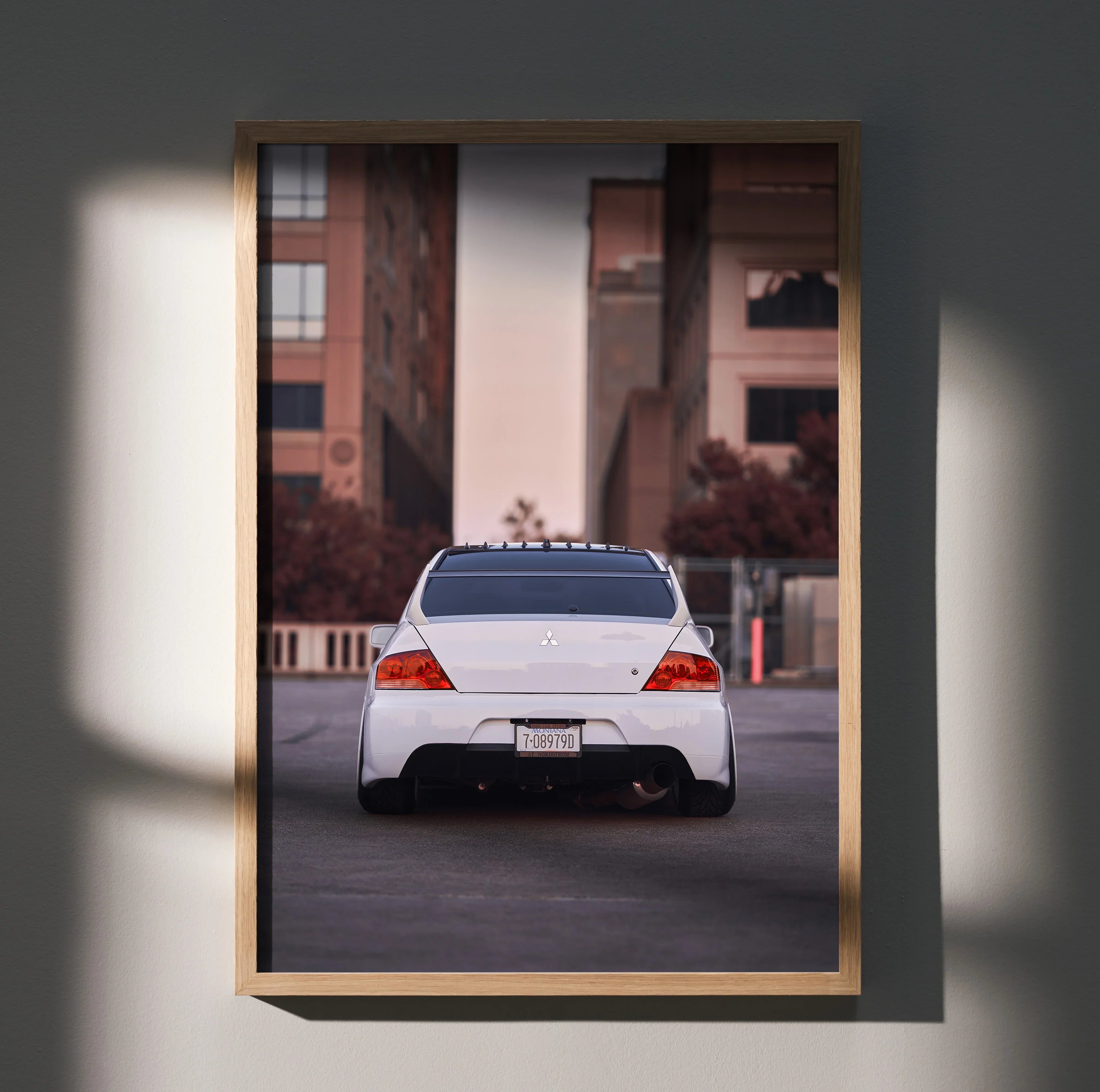 Mitsubishi Evo 8 rear view poster in urban setting, premium automotive wall art.