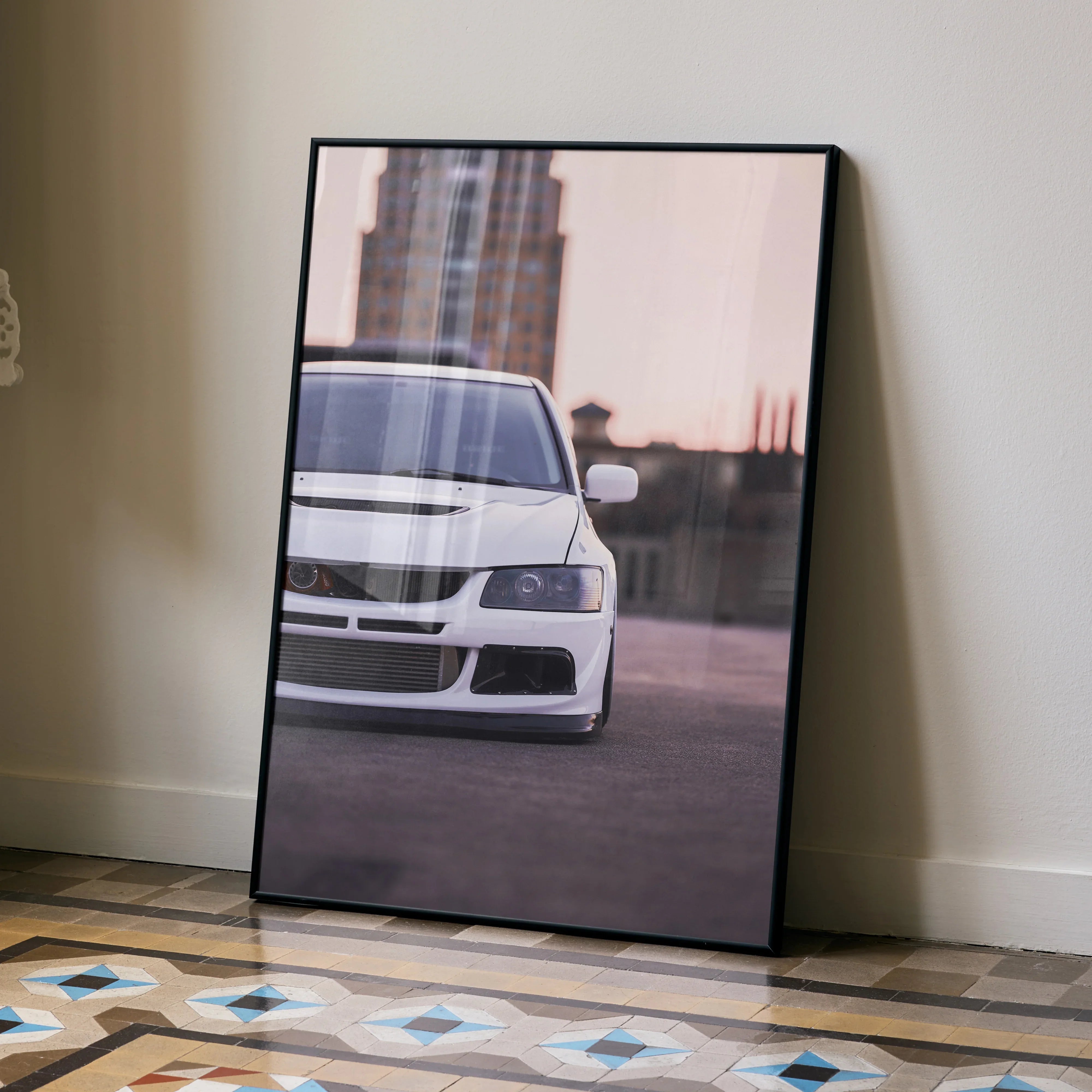 Mitsubishi Evo 8 front view poster with city backdrop, modern wall art in black frame.