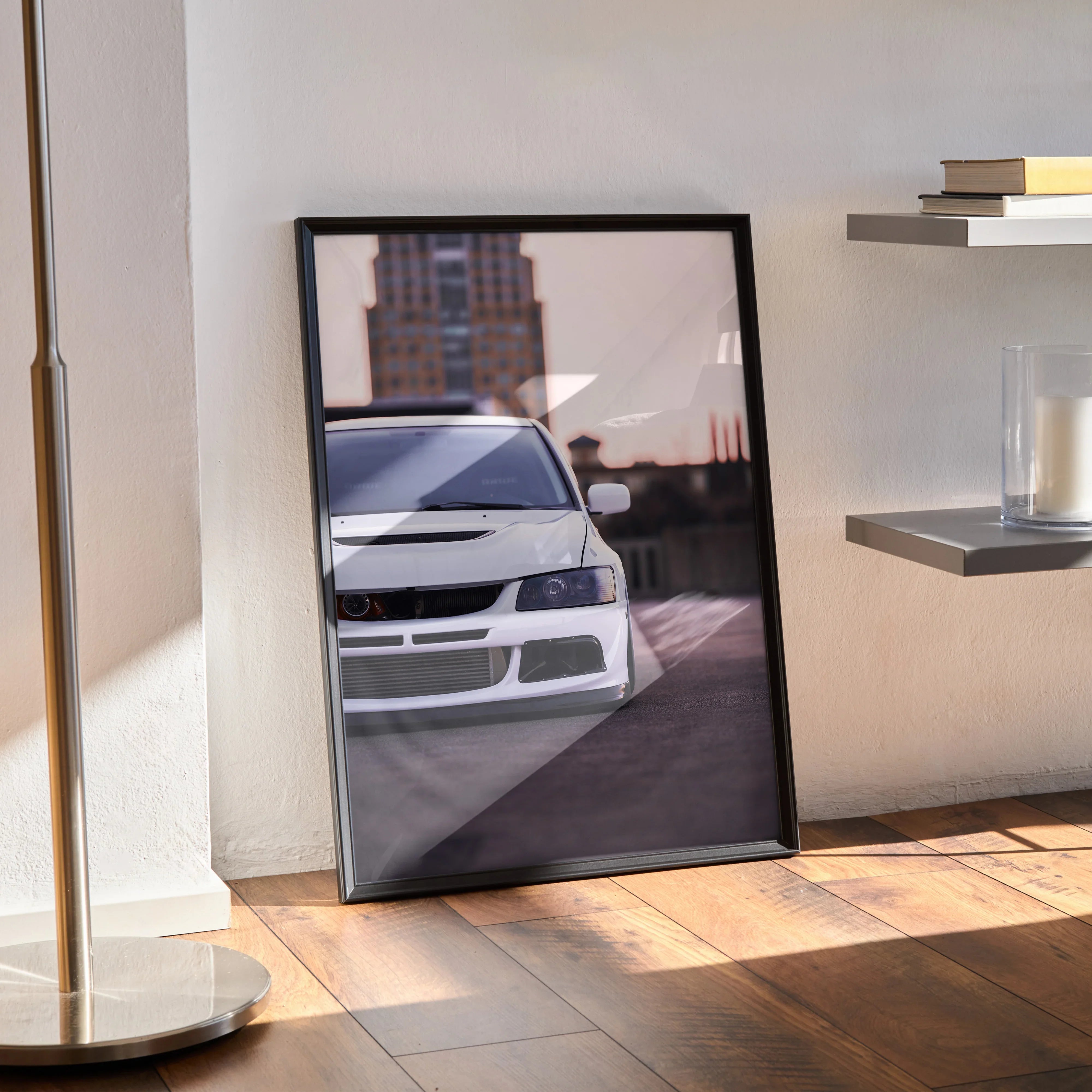 Mitsubishi Evo 8 front view poster leaning on floor with cityscape background wall art.