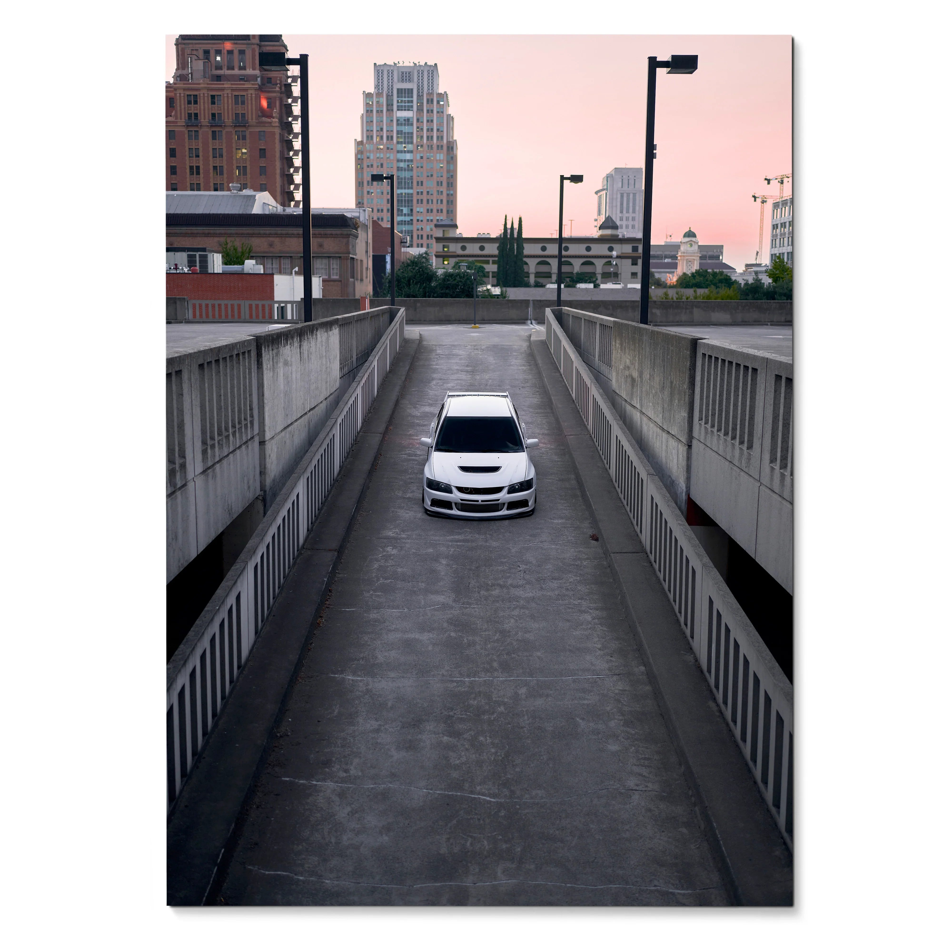 Mitsubishi Evo 8 in white parked on urban rooftop ramp at sunset poster wall art.