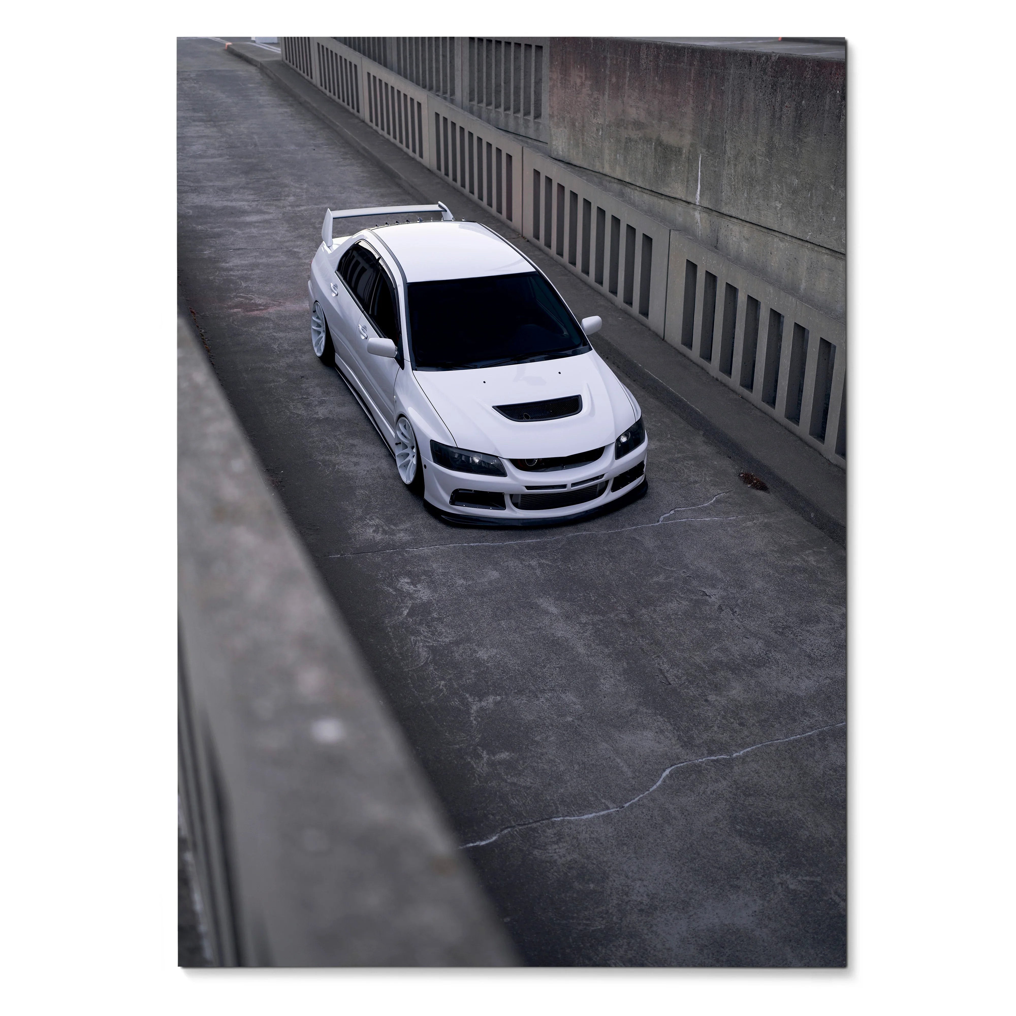 White Mitsubishi Evo 8 parked on concrete street poster wall art.