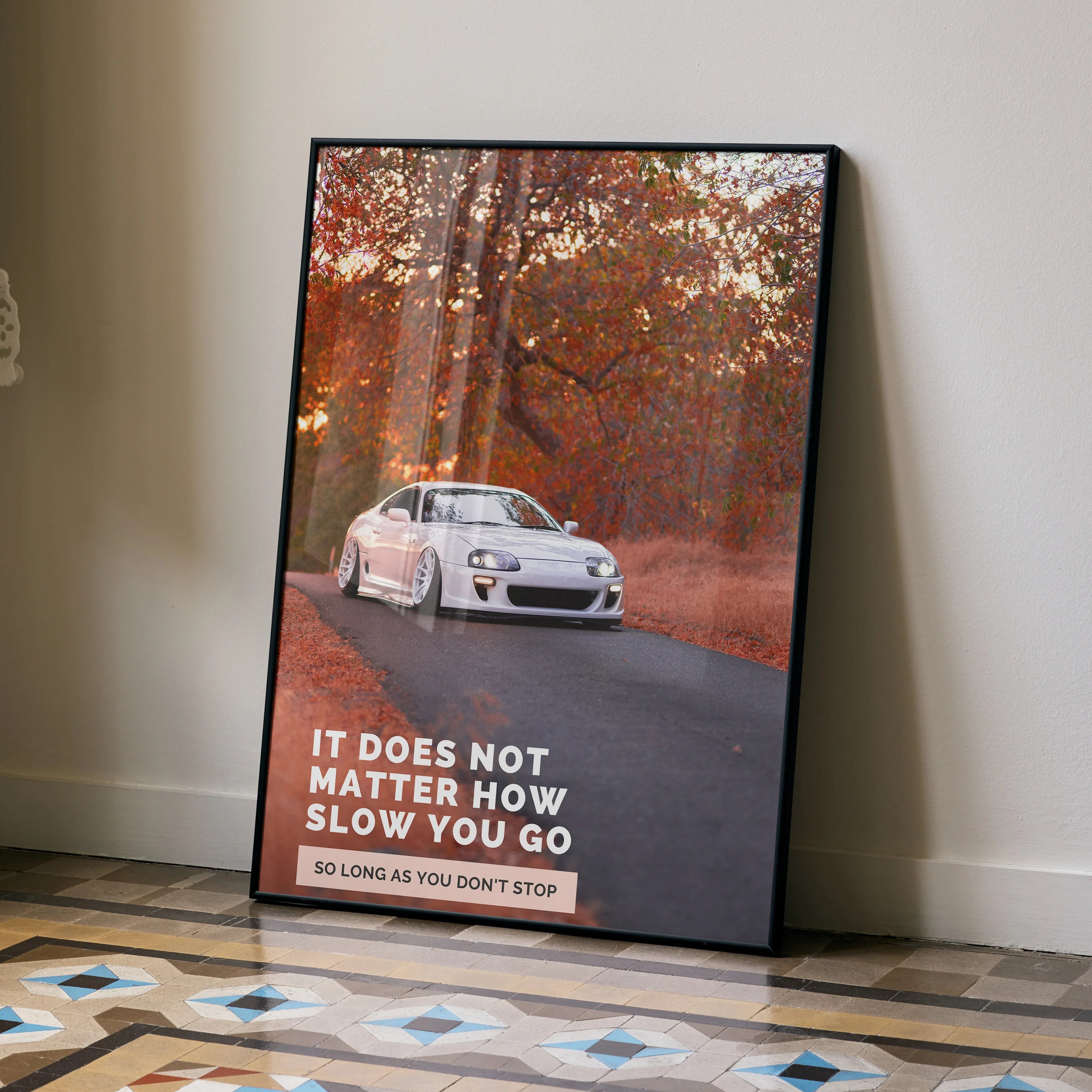 Toyota Supra Mk4 poster with white car on autumn road and motivational text wall art.