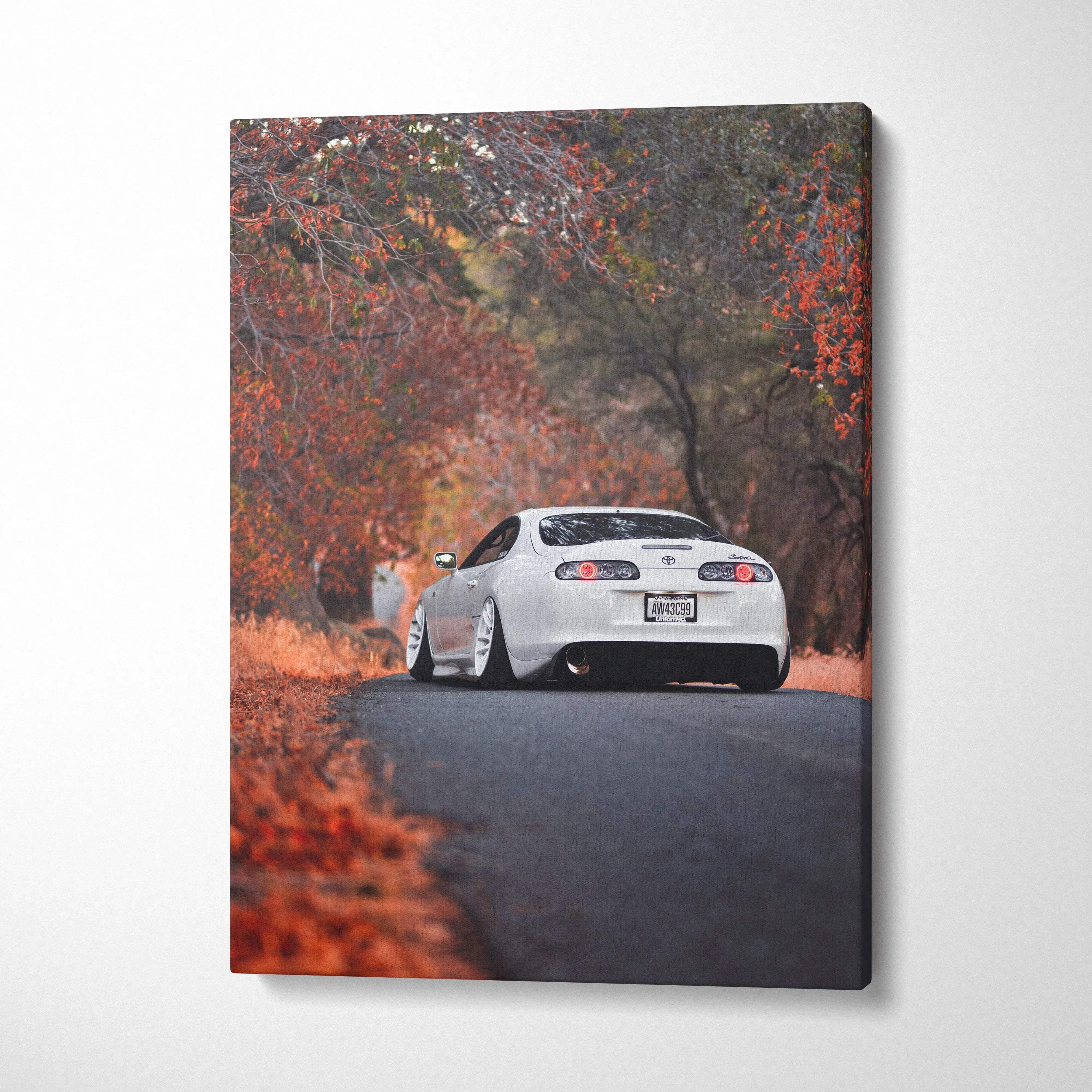 Toyota Supra MK4 on autumn road canvas art with vibrant fall foliage wall art.