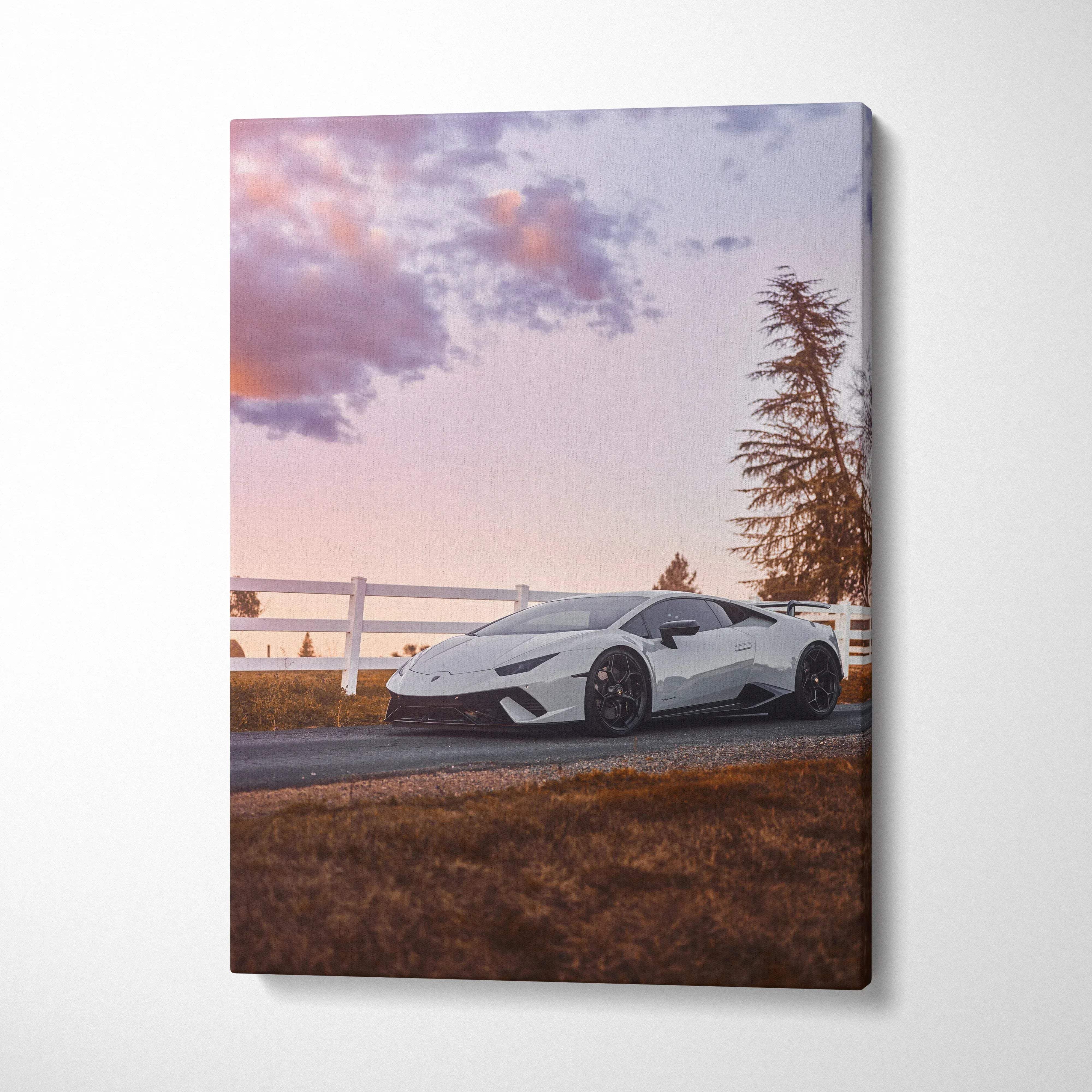 Vertical canvas wall art featuring a white Lamborghini Huracan at sunset with soft purple skies.