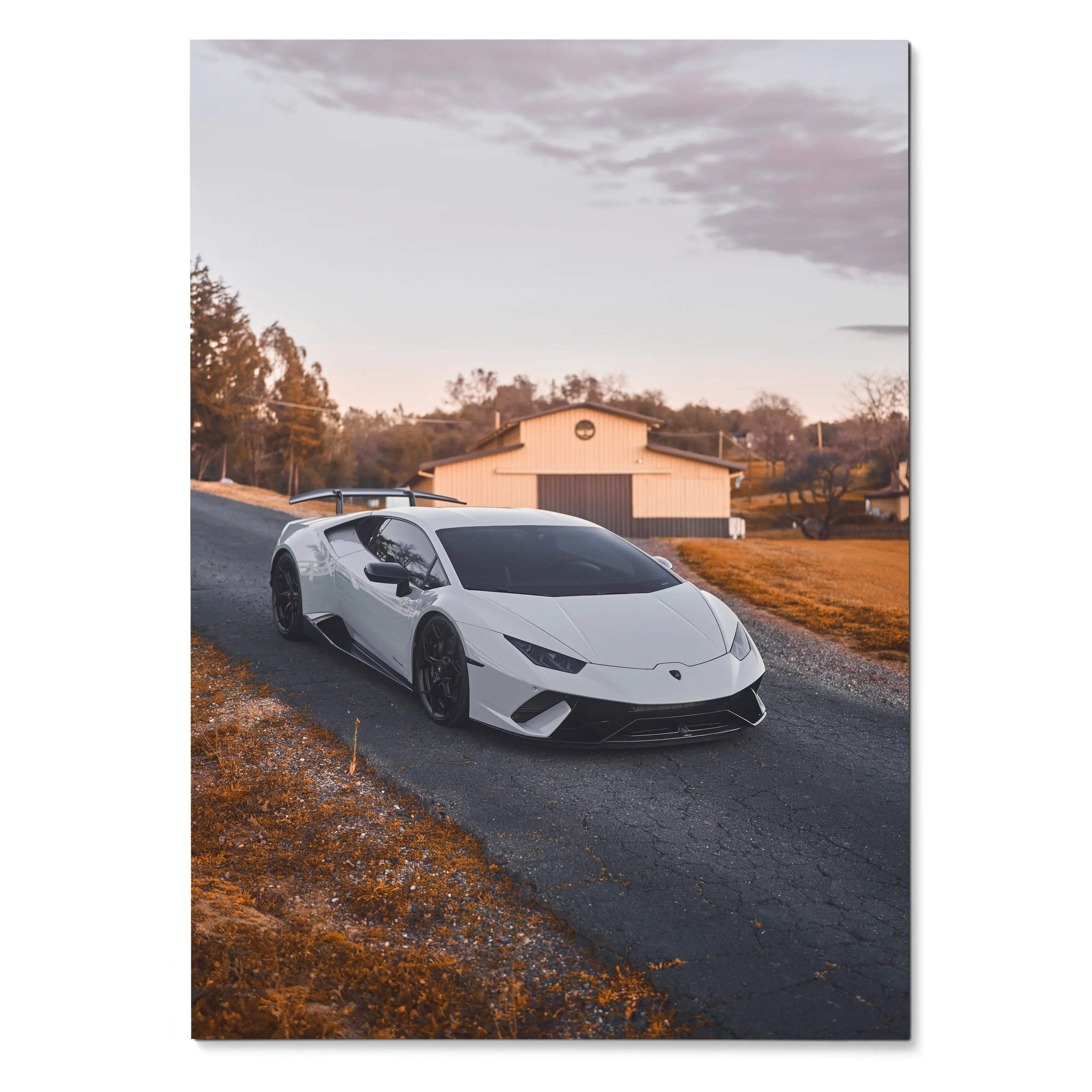 White Lamborghini Huracan parked on country road under soft evening sky poster wall art.