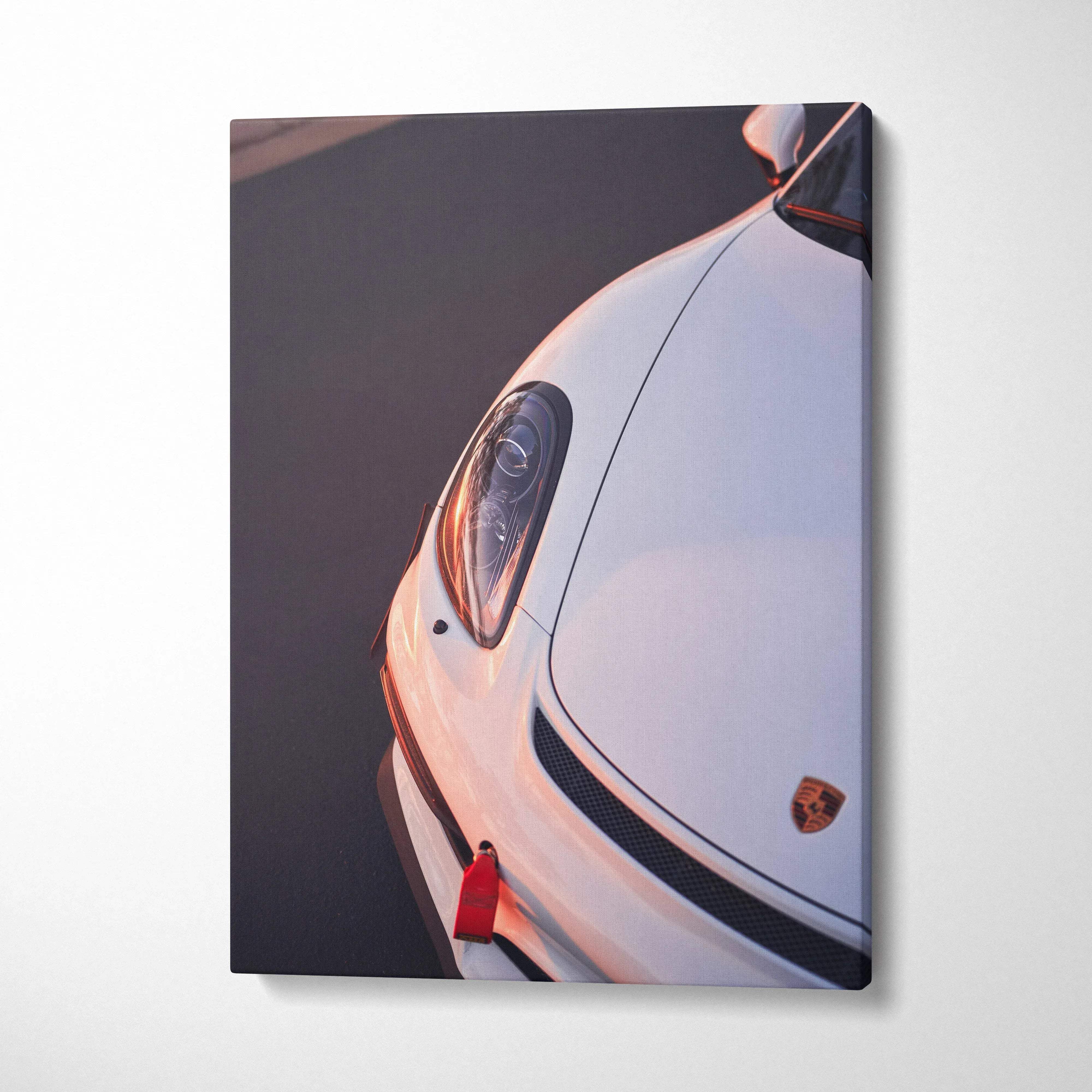 White Porsche GT4 close-up canvas art, vertical wall art with car headlight and emblem detail.