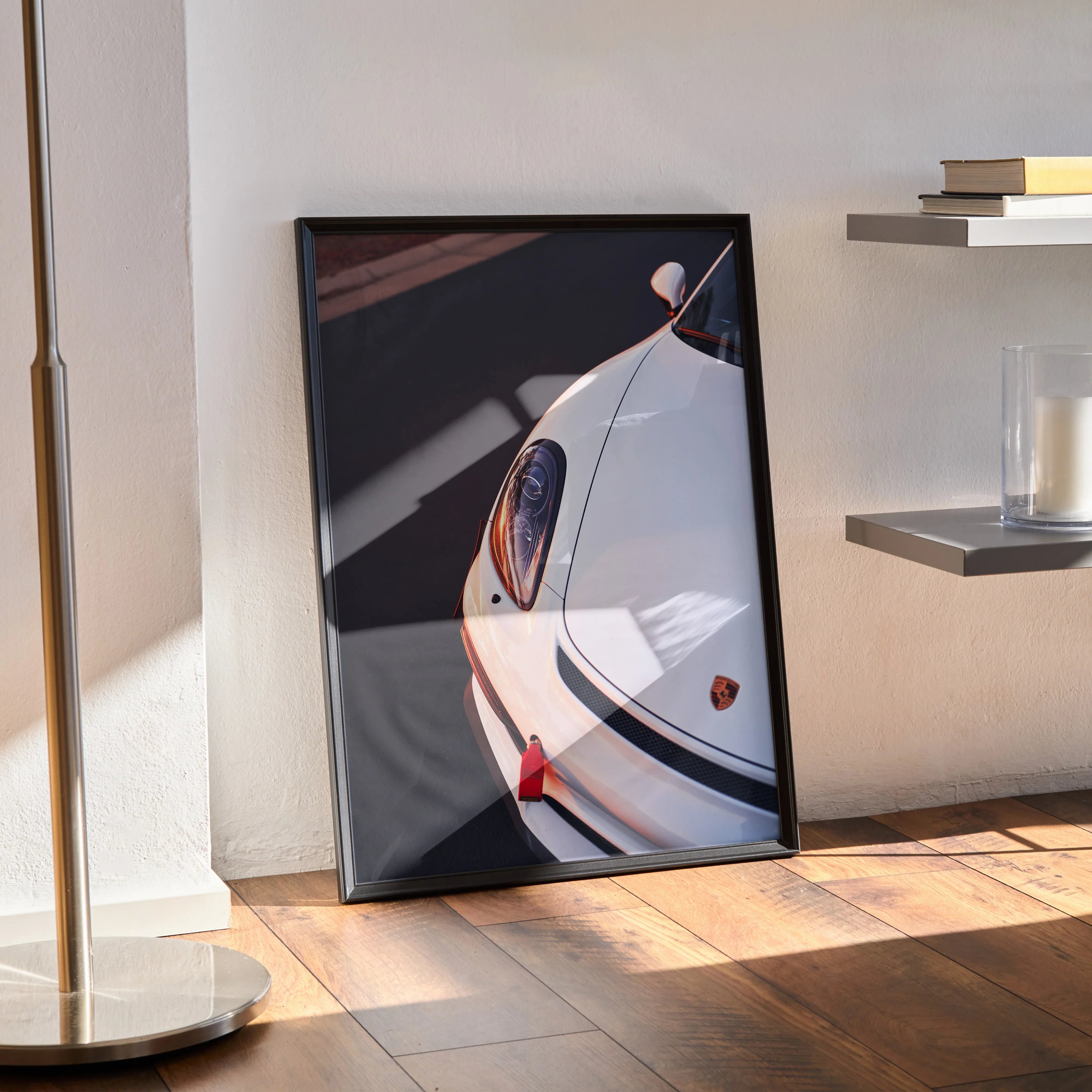 Porsche Cayman GT4 poster featuring close-up front view with sleek white curves, modern wall art in black frame.