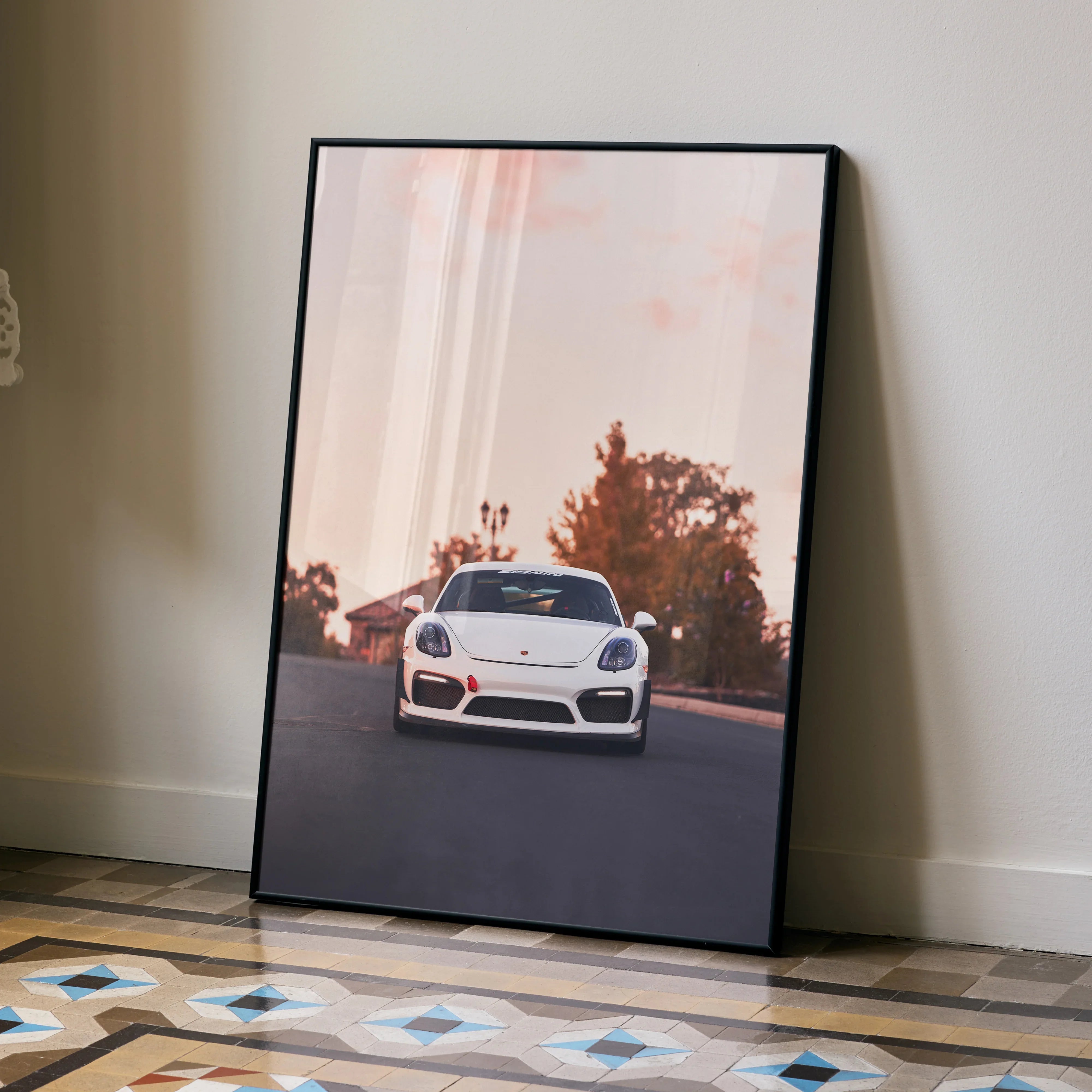 Porsche Cayman GT4 poster with white sports car on sunset road, automotive wall art.