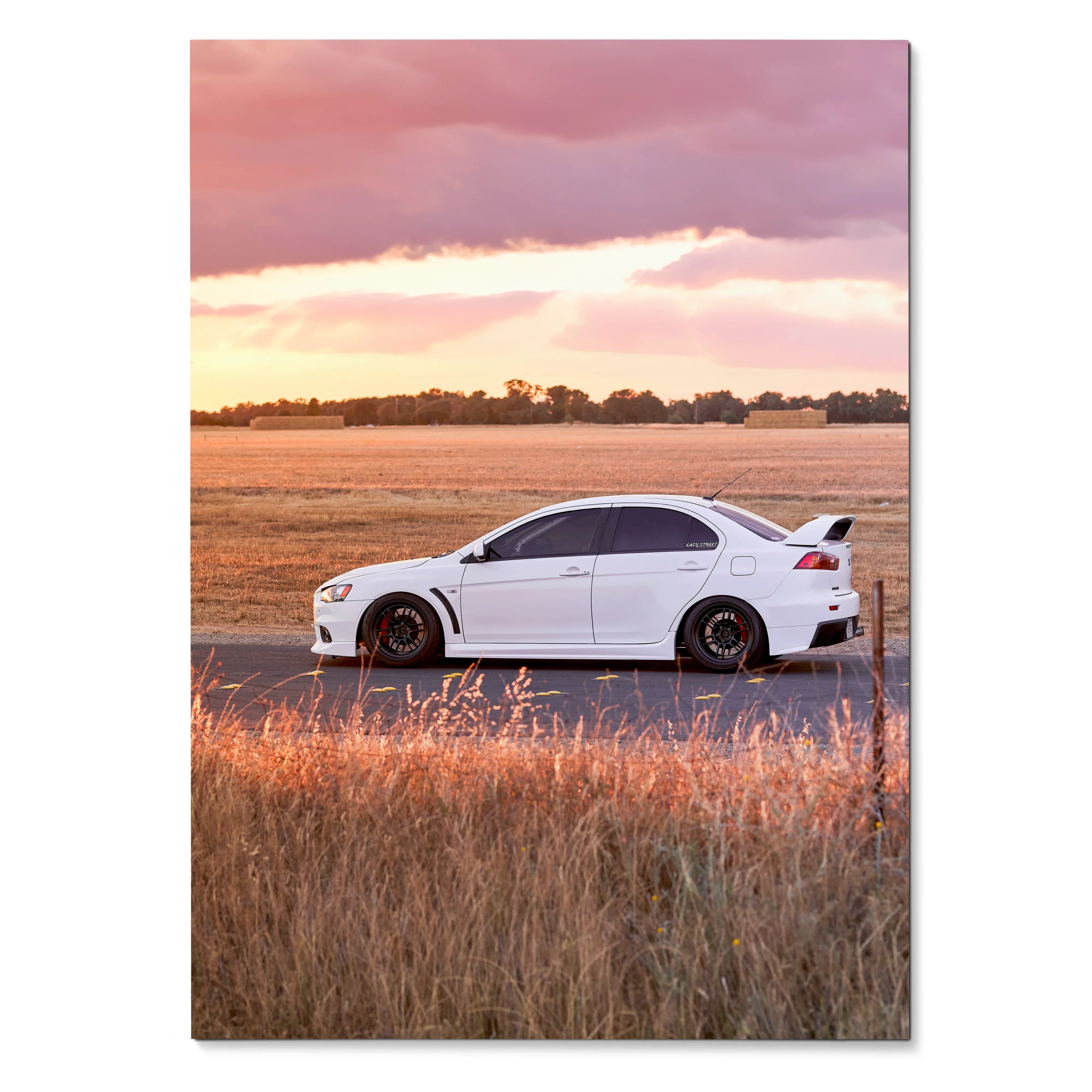 Mitsubishi Evo 10 parked on road at sunset in high-resolution poster wall art.