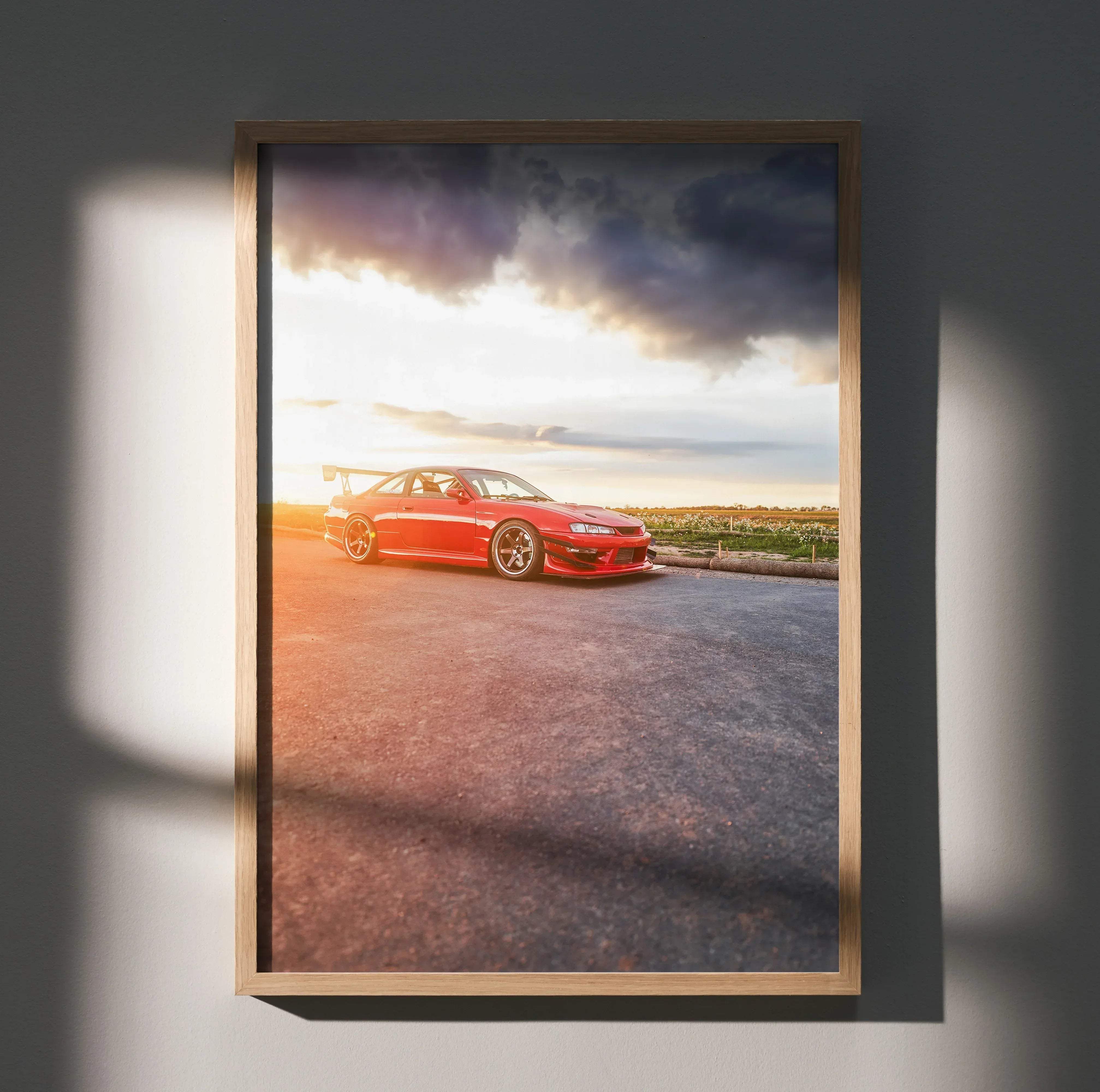 Red nissan skyline r34 sports car poster in a light wood frame for nissan 240sx s14 kouki high resolution car poster 019