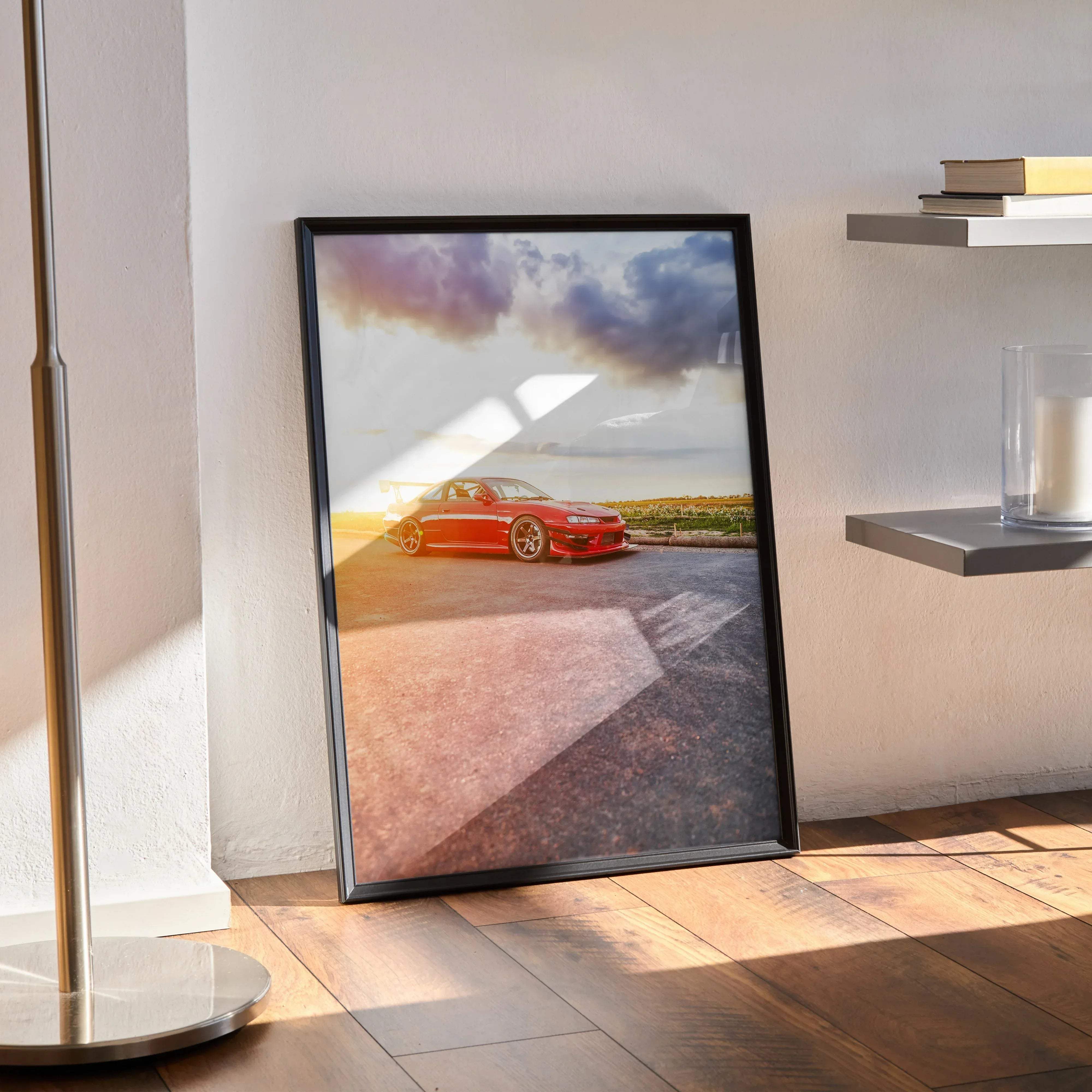 Black-framed poster of a vibrant red nissan 240sx s14 kouki car under dramatic sunset skies high resolution print