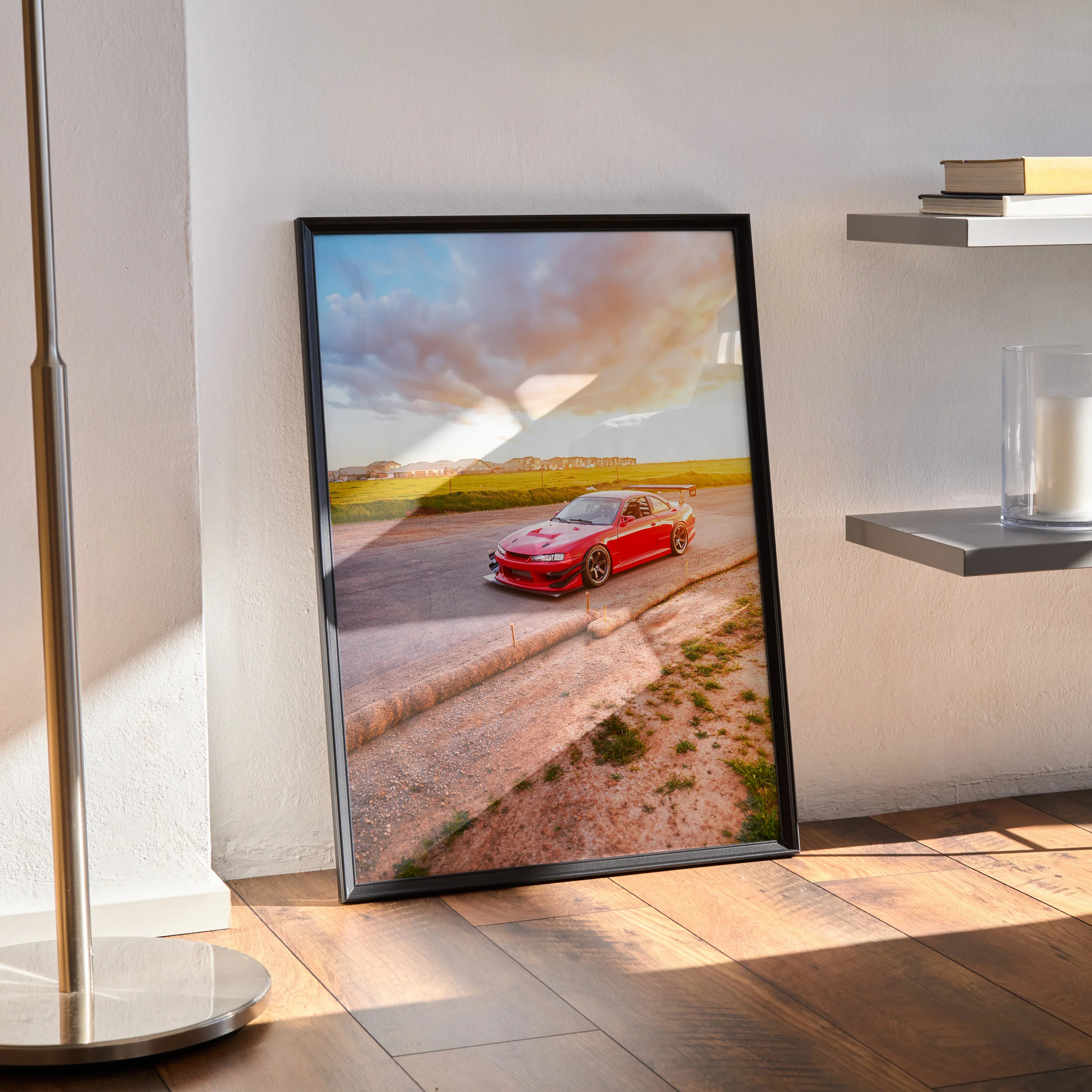 Nissan 240sx S14 Kouki red car poster with sunset sky framed wall art leaning on floor.