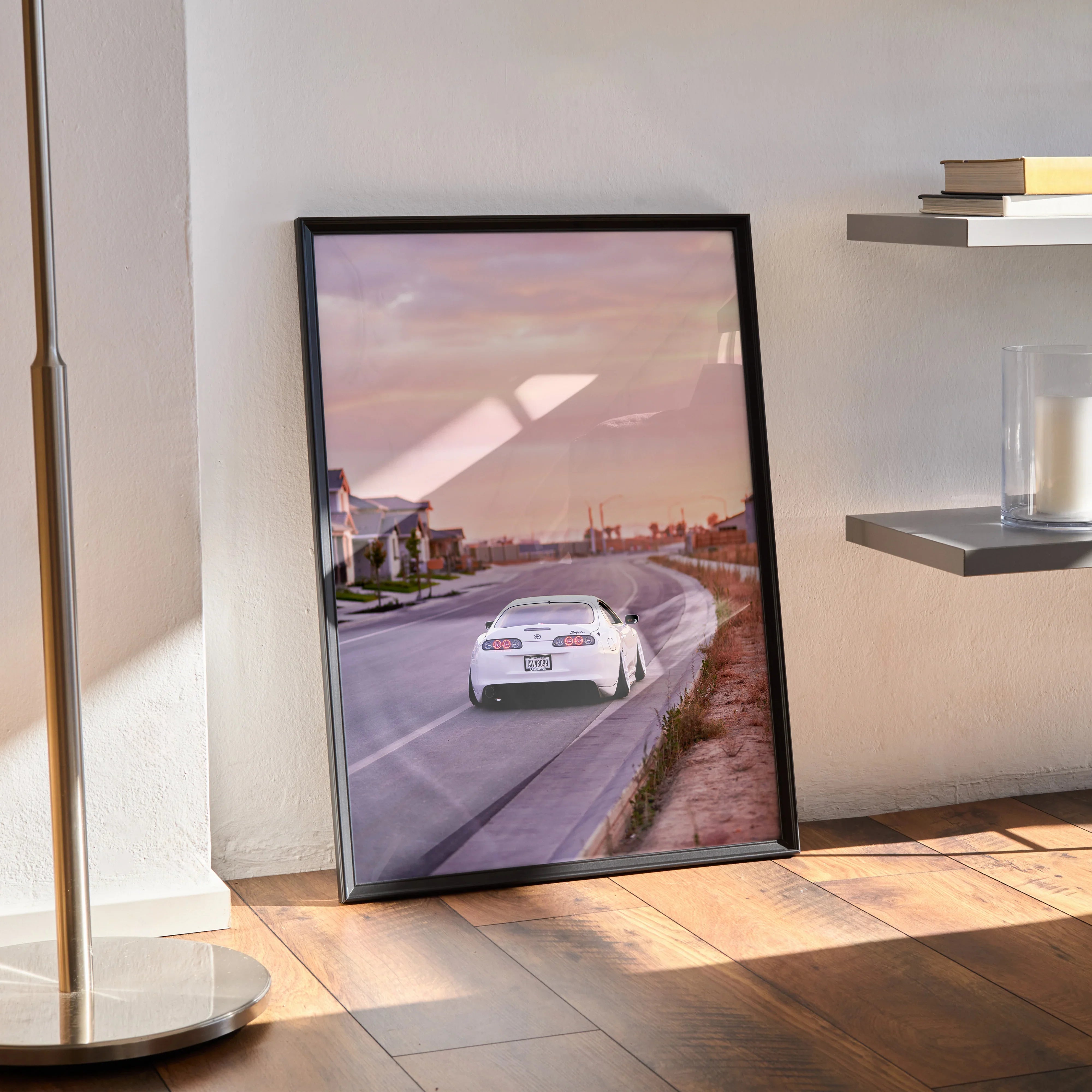 Supra MK4 car poster with sunset background, sleek white Toyota sports car wall art in black frame.