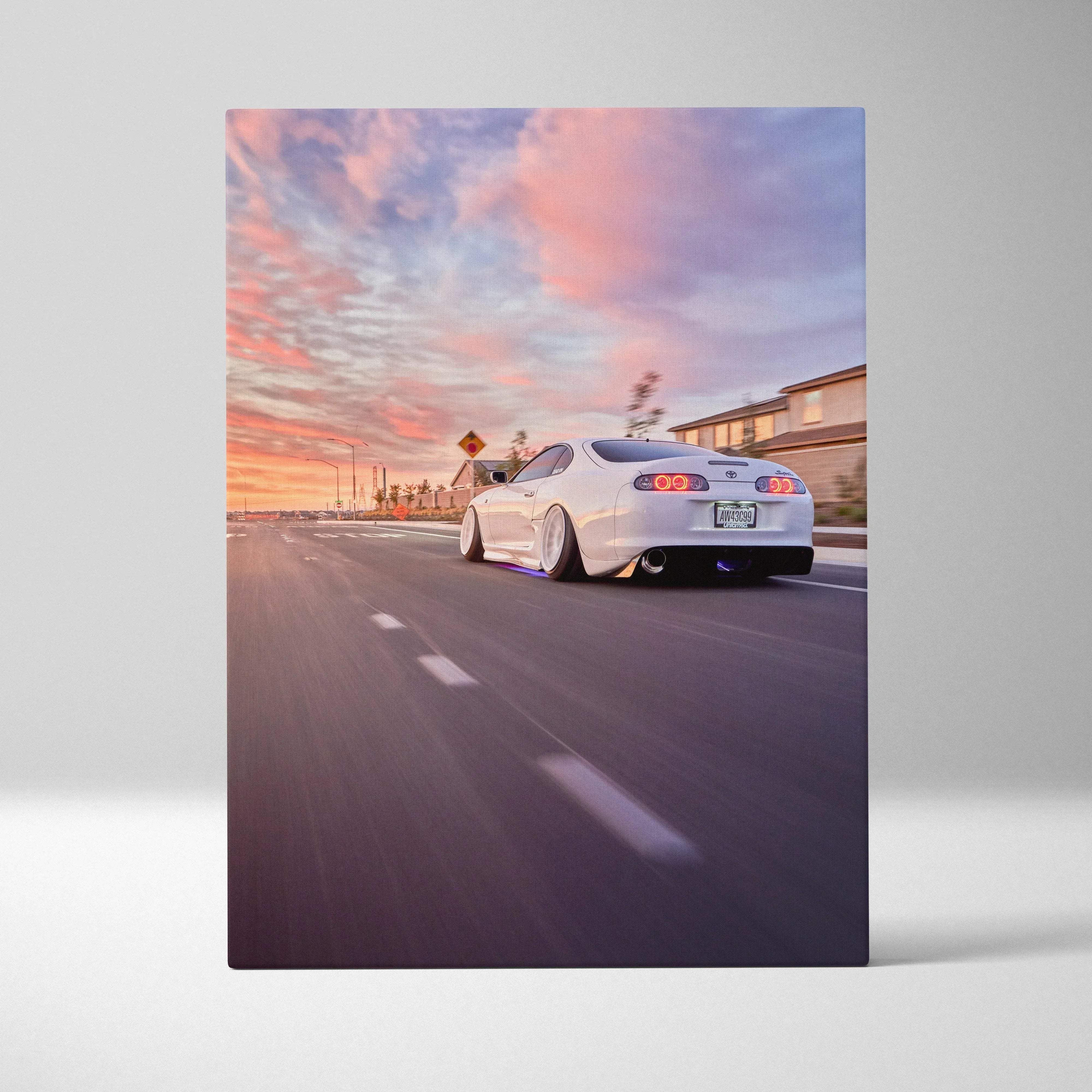 Canvas wall art featuring a white toyota supra mk4 with custom low-profile wheels and glowing underglow lighting