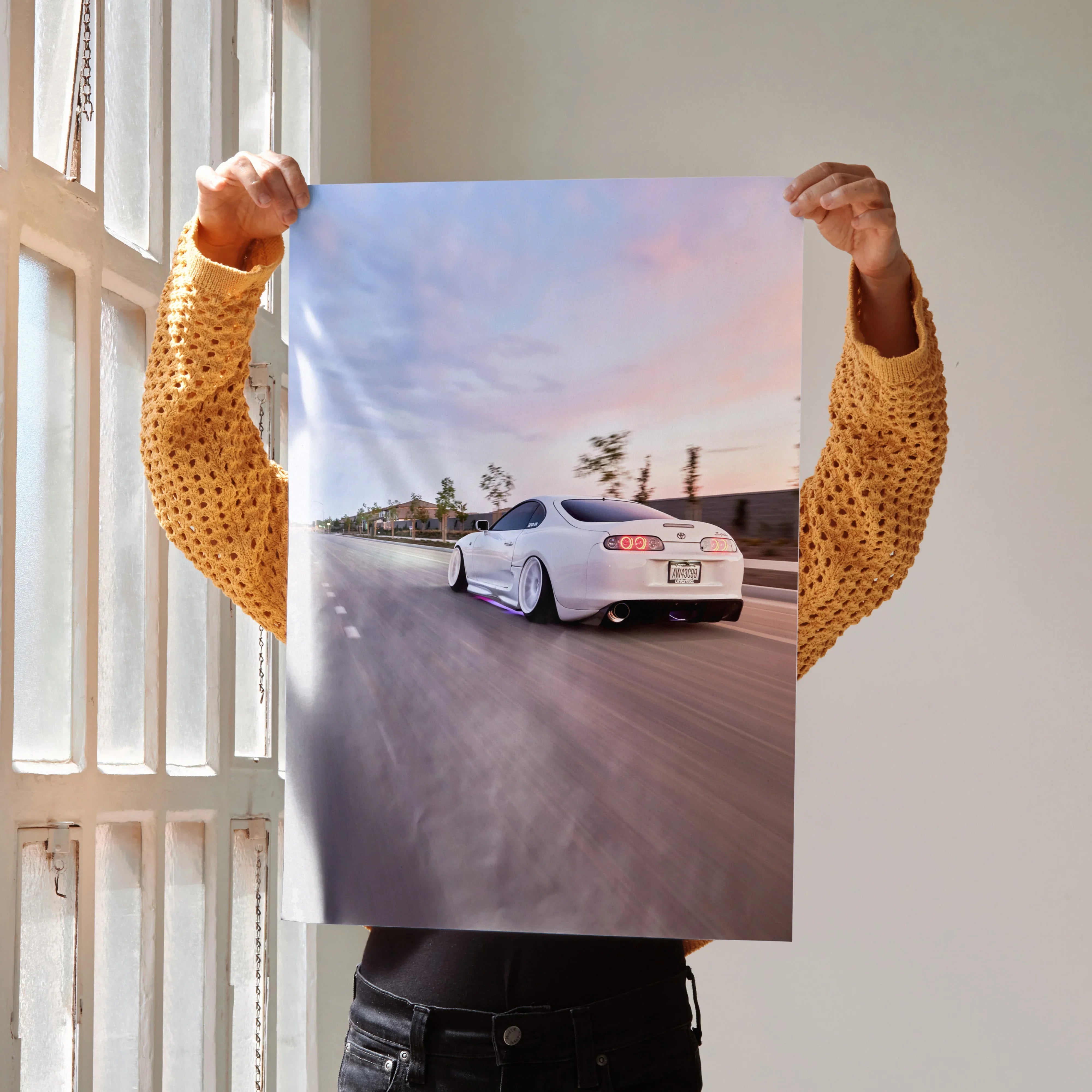 Supreme Toyota Supra MK4 poster featuring a white sports car on a road at sunset, wall art print.