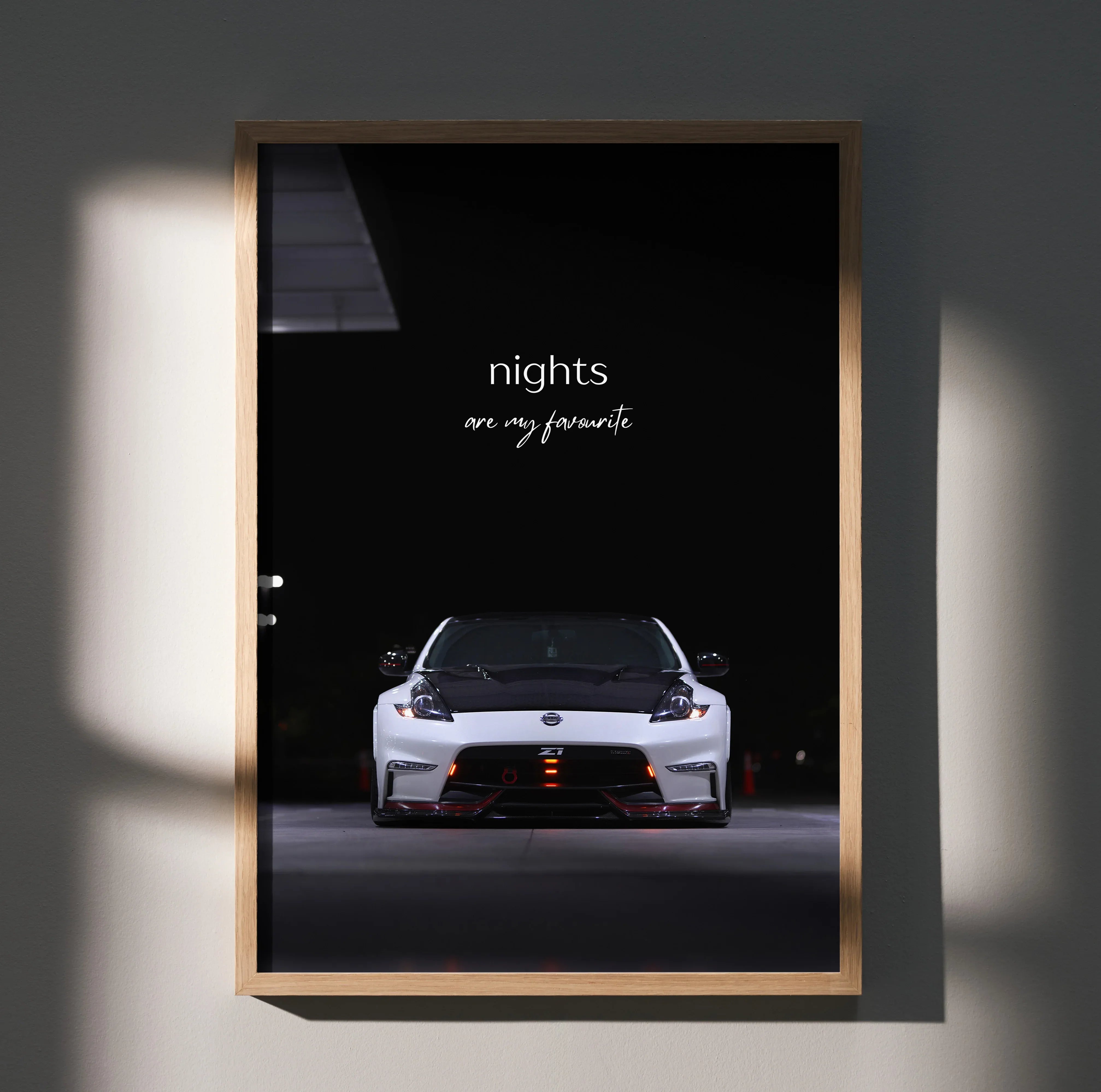 Nissan 370z front view with "nights are my rewards" text motivational poster wall art in wood frame.