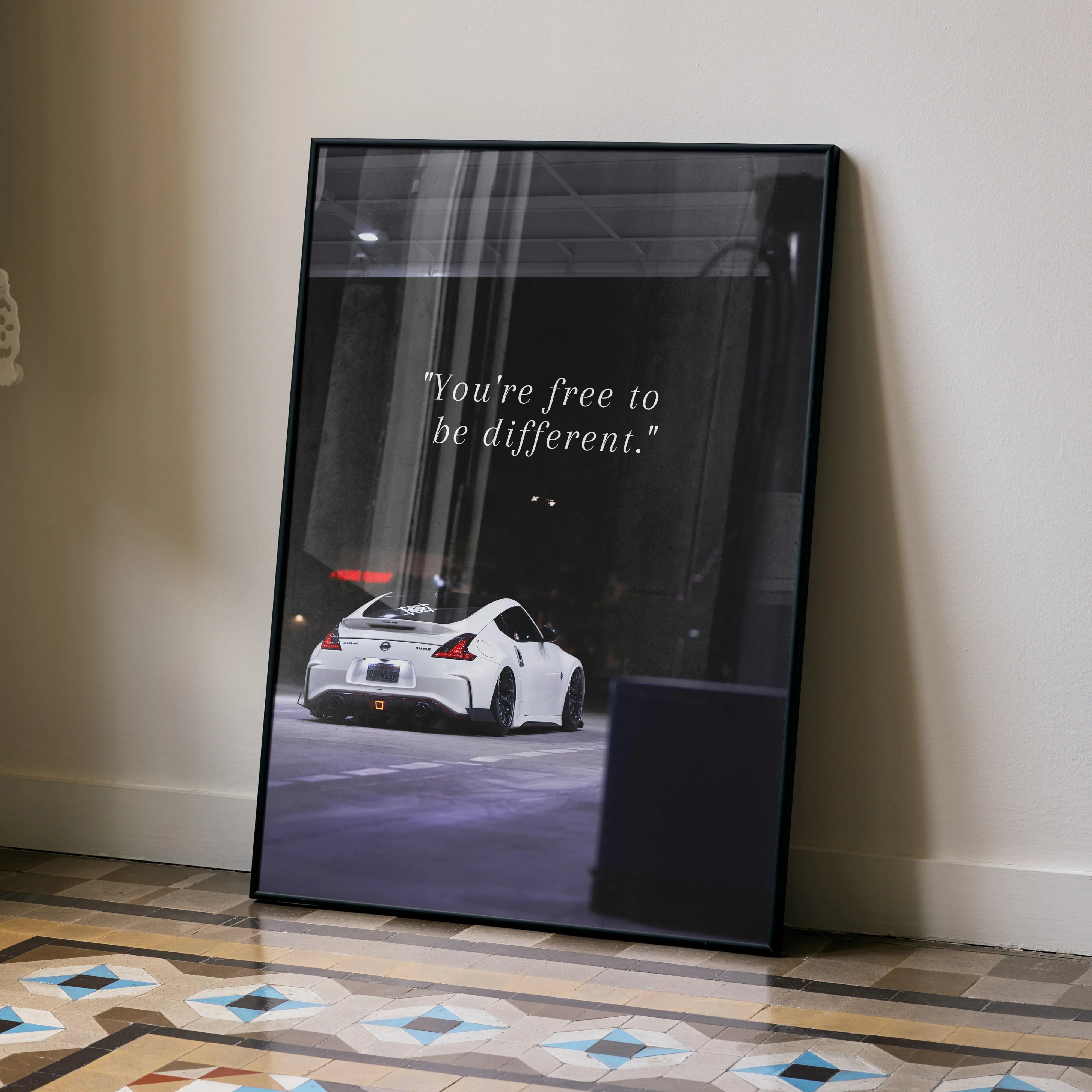 Motivational poster wall art featuring white Nissan 370z with inspiring text "You're free to be different.".