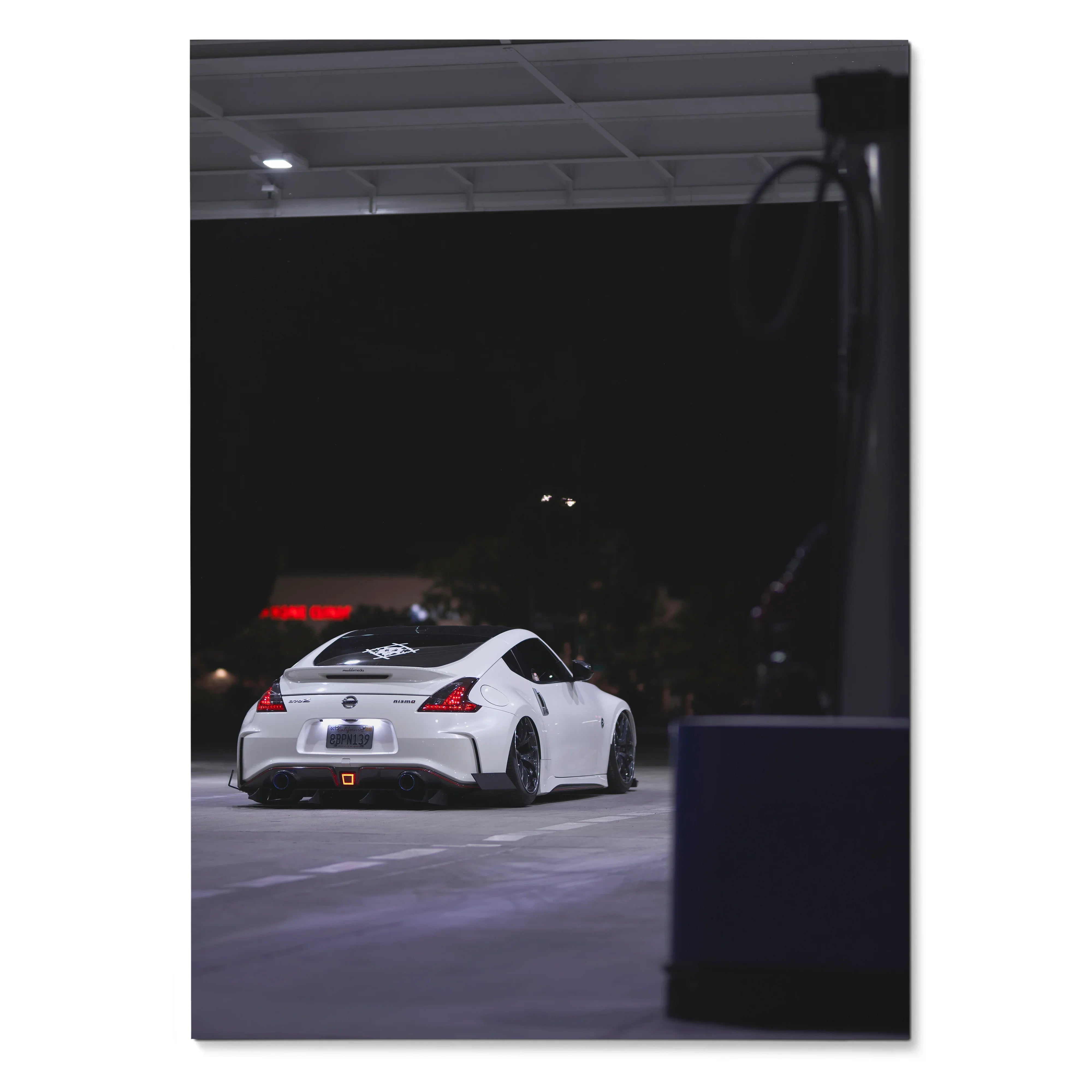 White Nissan 370z sports car at night wall art poster with minimalist urban background.