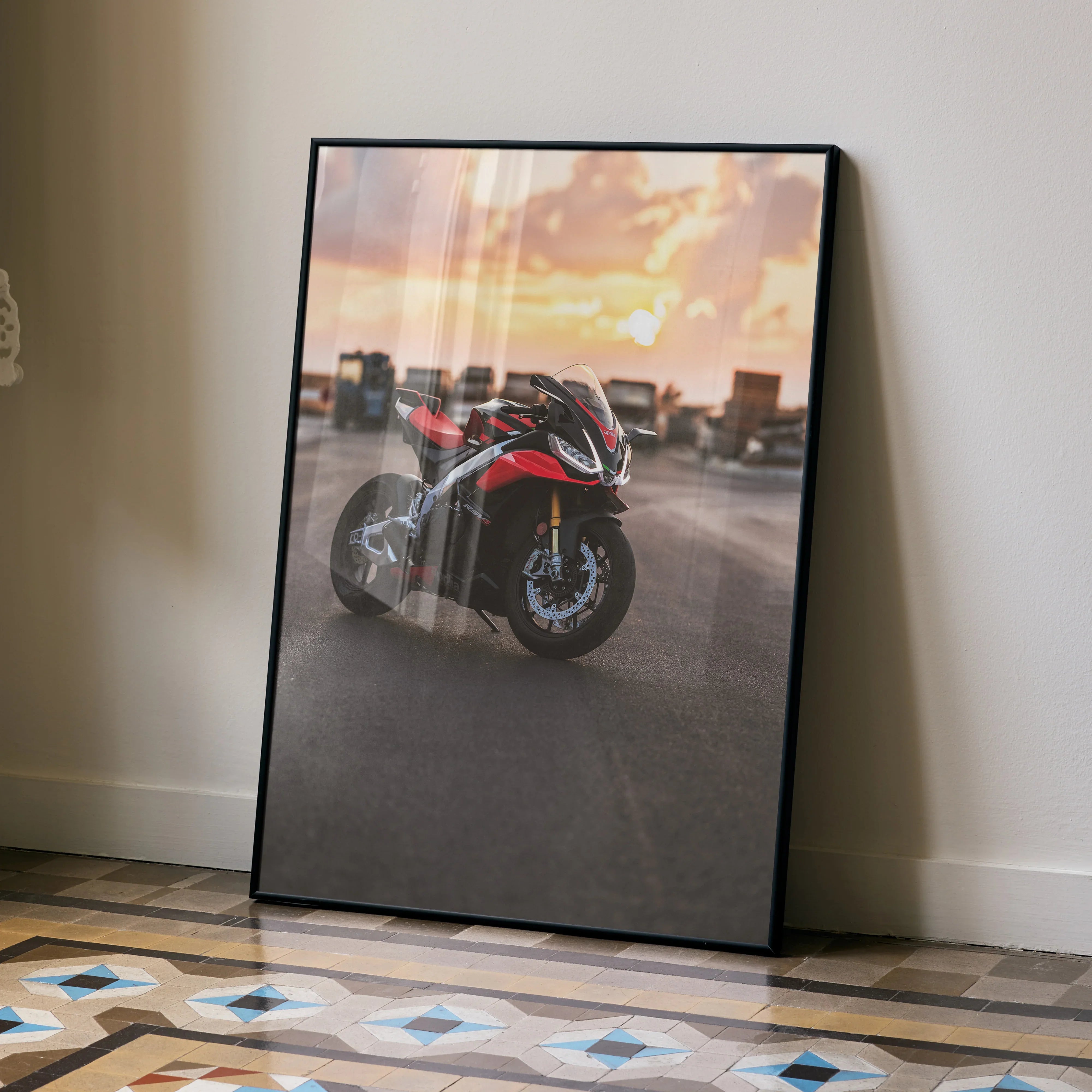 Aprilia RSV4 1100 Factory motorcycle poster with sunset background wall art in black frame.