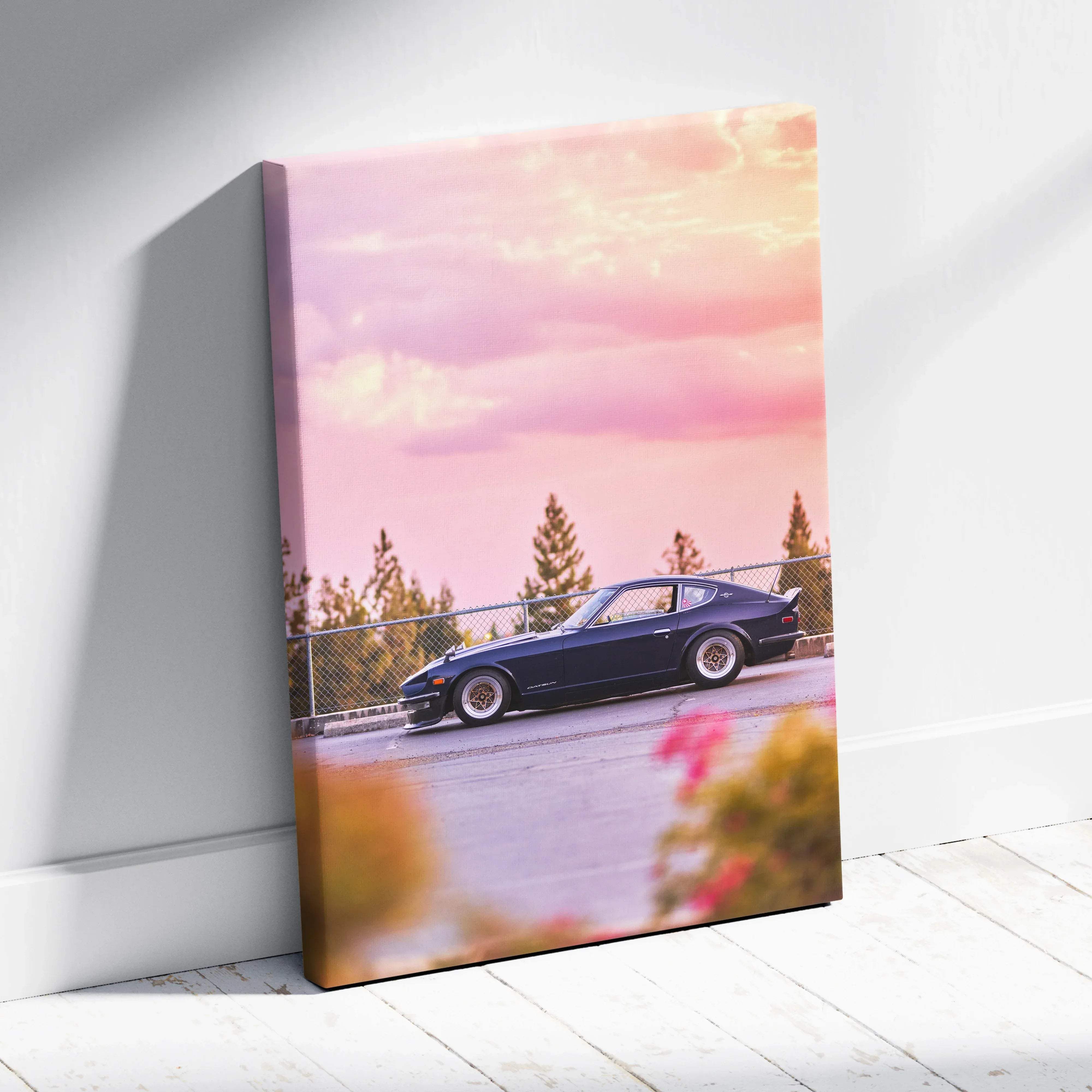 Navy blue canvas wall art featuring a nissan 240z classic sports car under pink and orange sunset sky