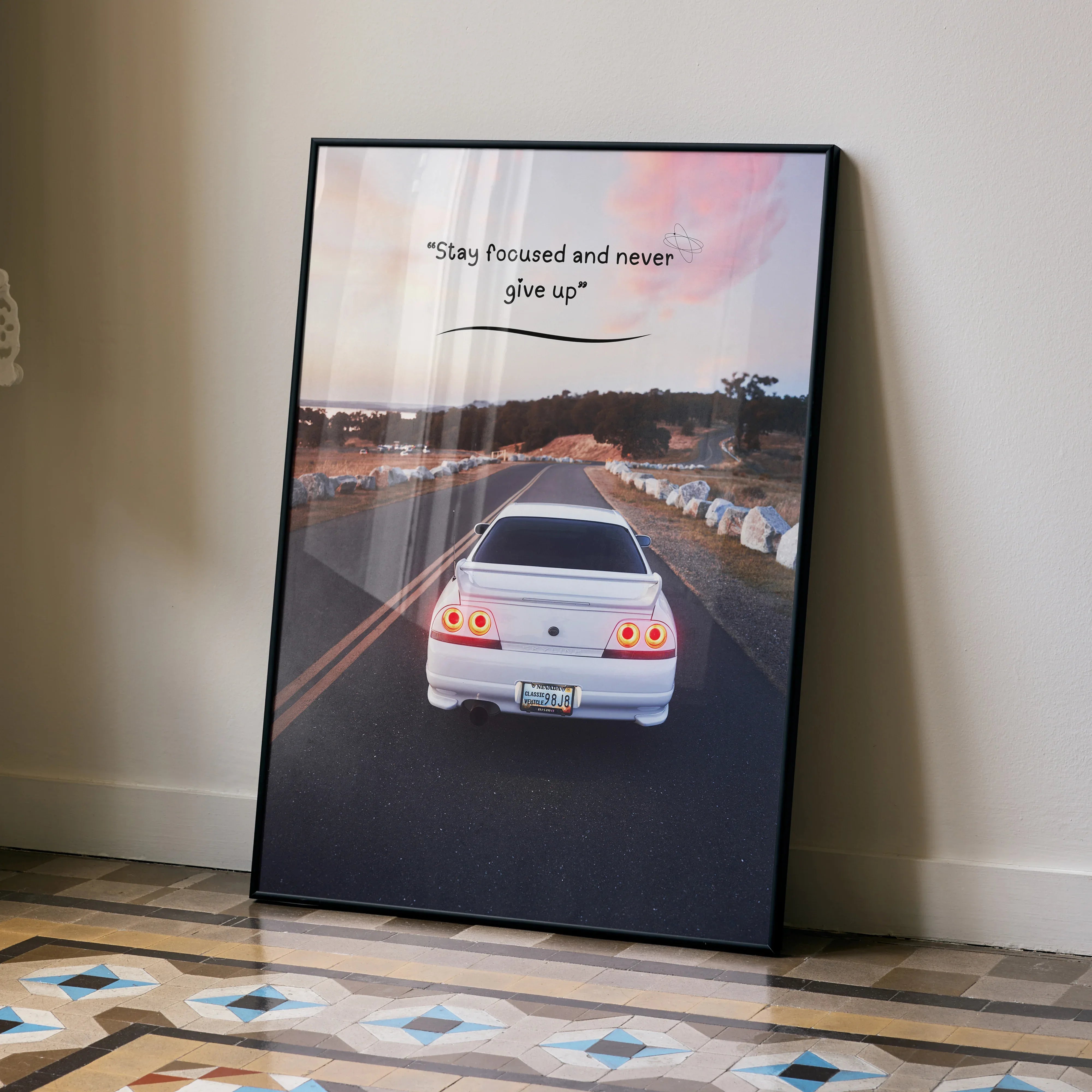 Motivational poster wall art featuring white Nissan R33 Skyline GTS-T on road with inspiring text.
