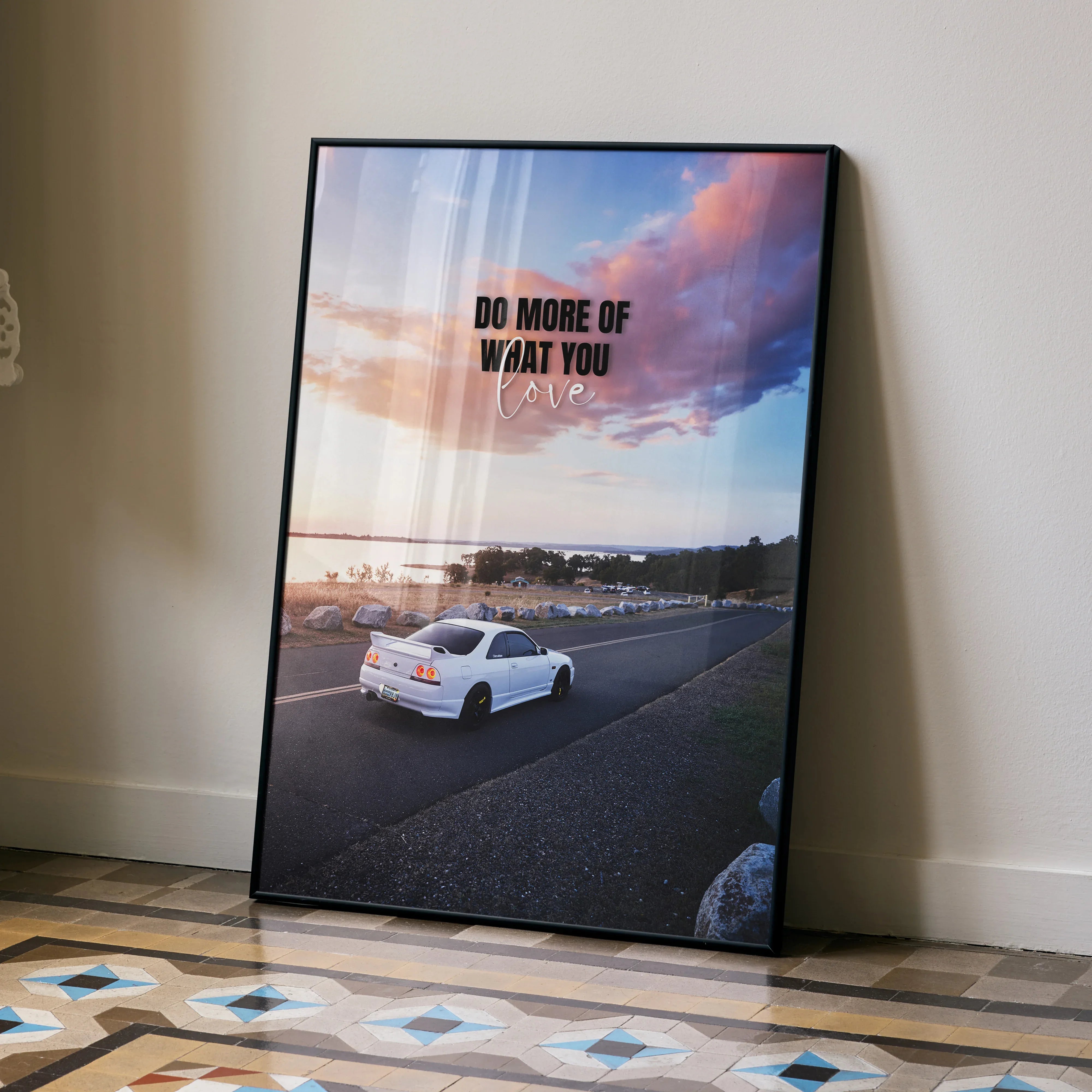 Motivational poster featuring white Nissan R33 Skyline GTS-T on road under vibrant sunset sky wall art.