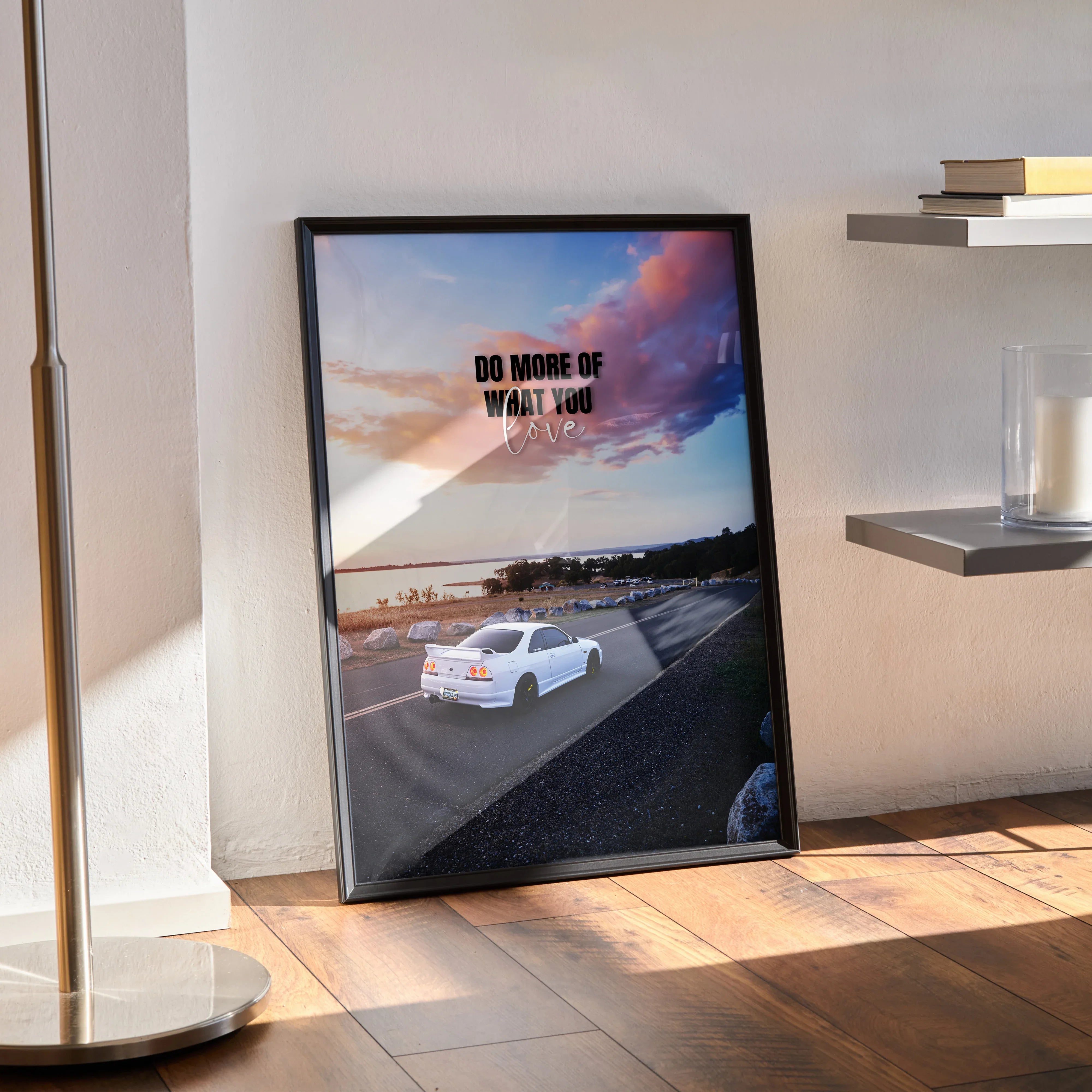 Motivational poster wall art featuring a white Nissan R33 Skyline GTS-T on a road under a colorful sunset sky with the text.