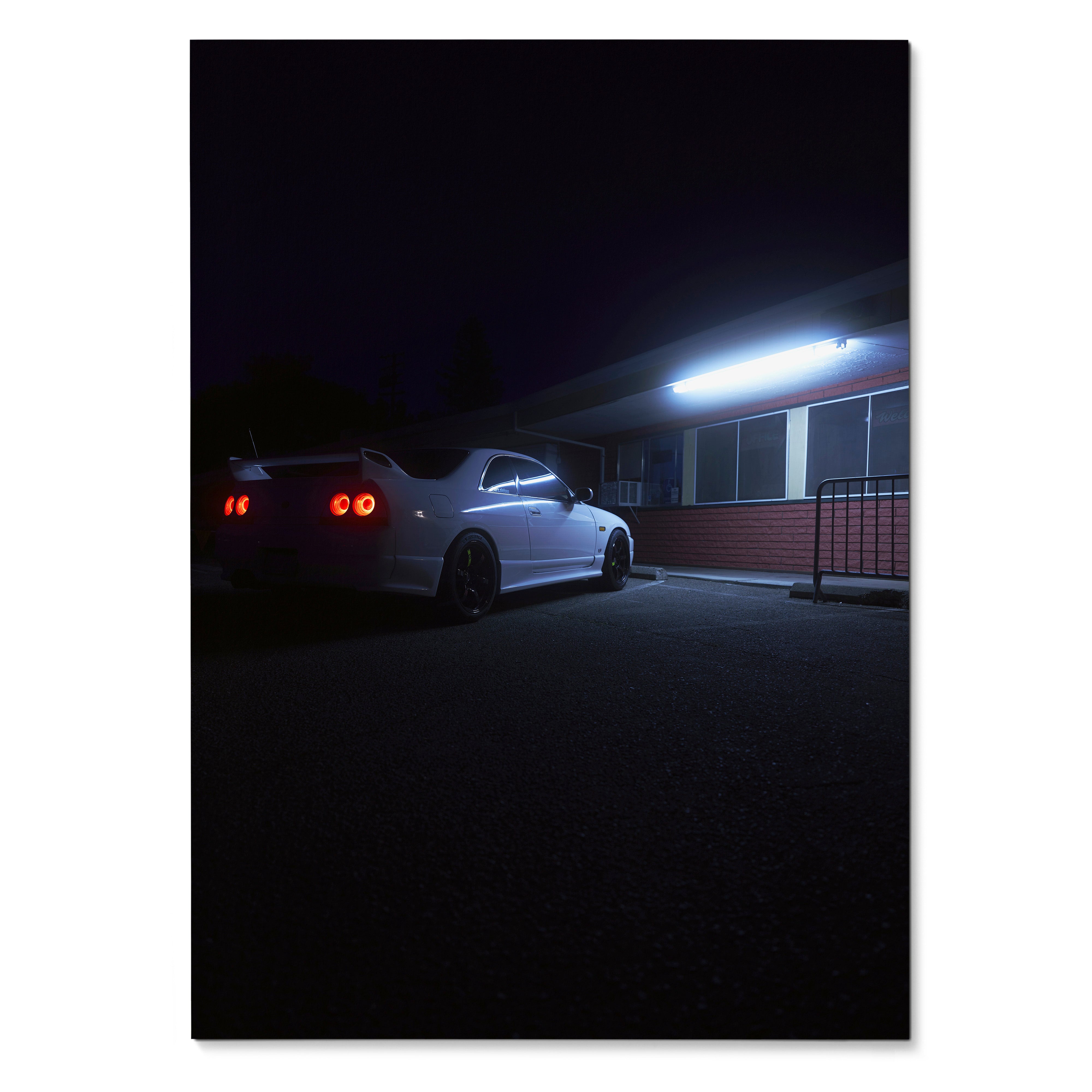 Nissan Skyline R33 GTS-T parked at night with glowing taillights poster wall art.