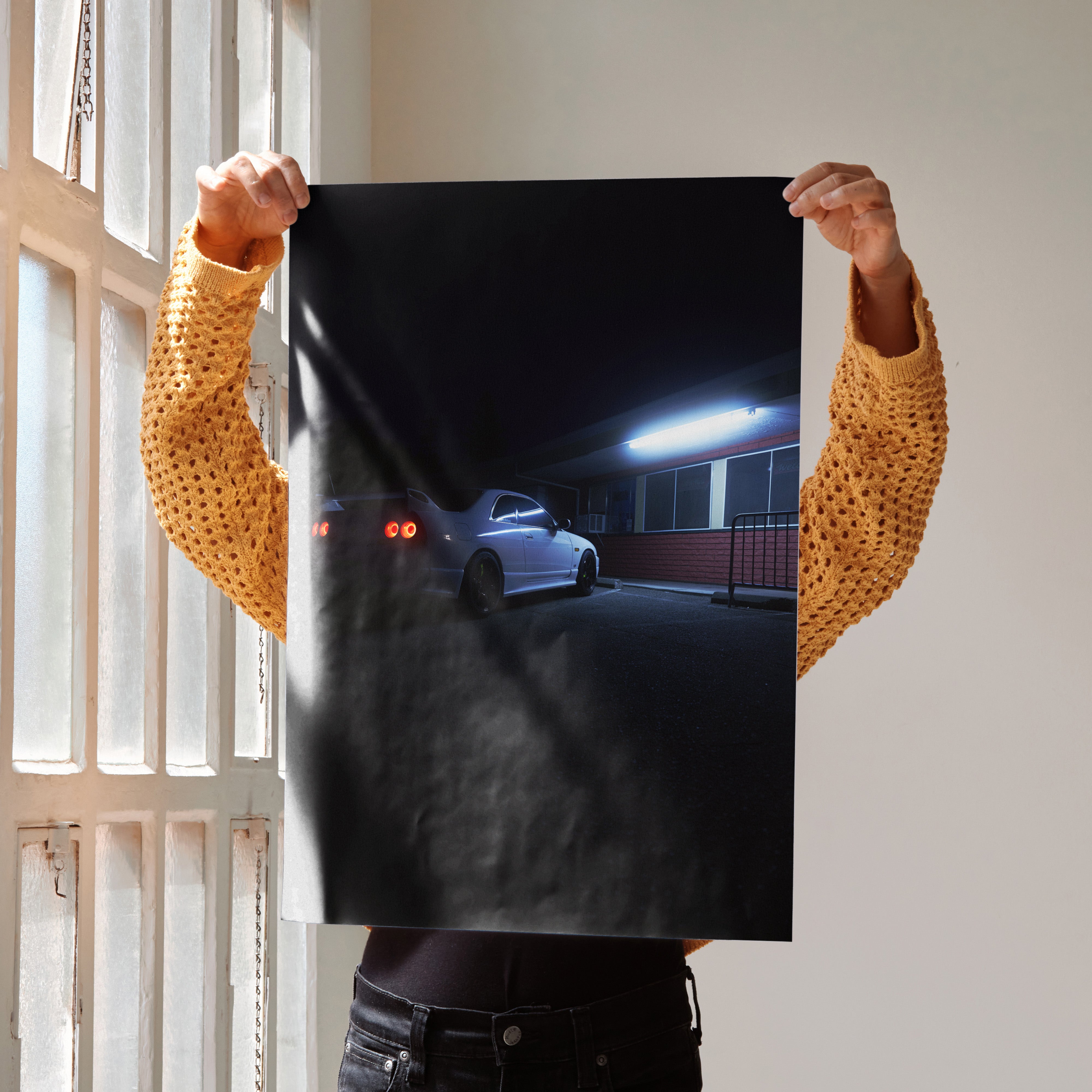 Nissan Skyline R33 GTS-T poster showing rear view of the car at night with glowing taillights, wall art with dark background.