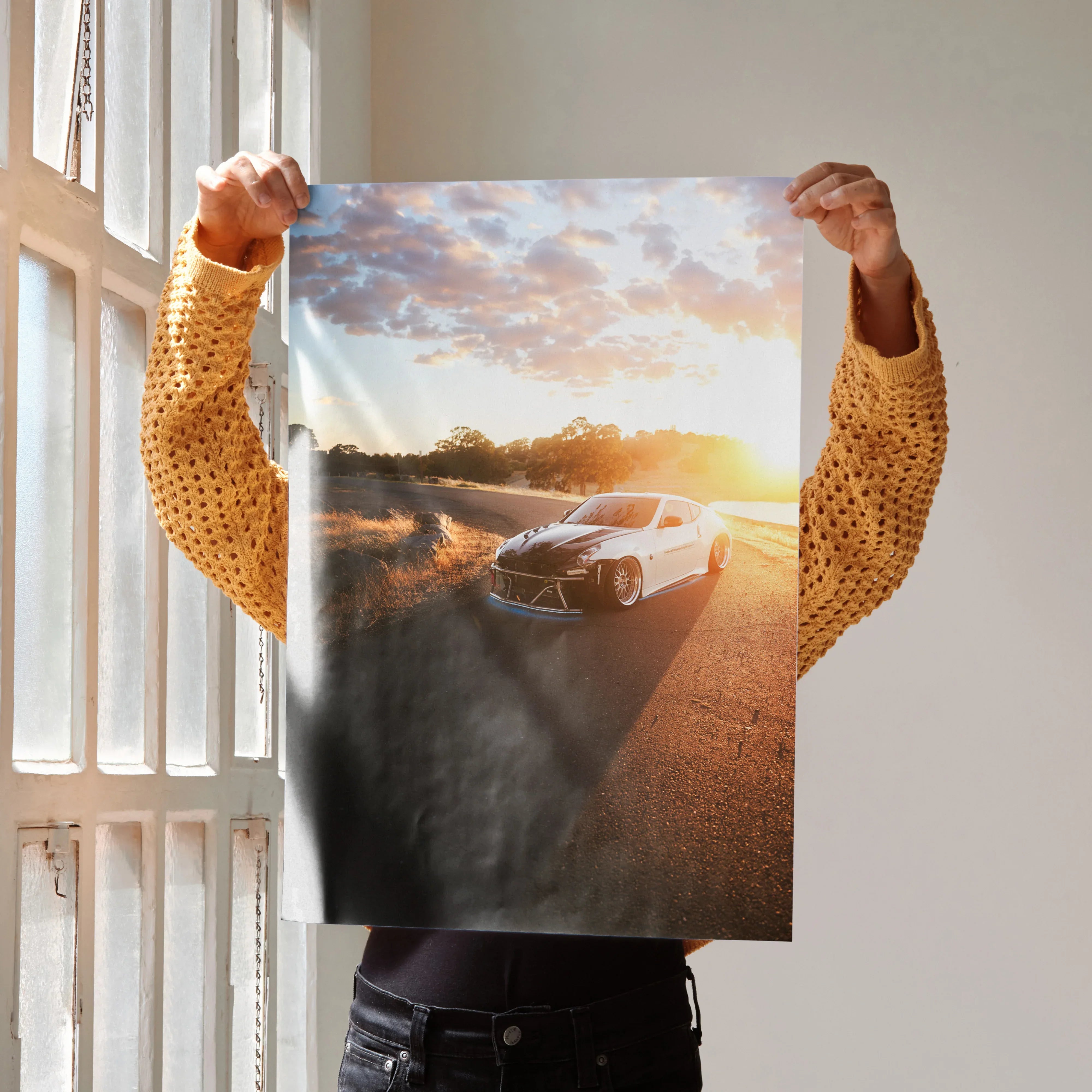 Nissan 370z parked on road at sunset with dramatic sky poster wall art.
