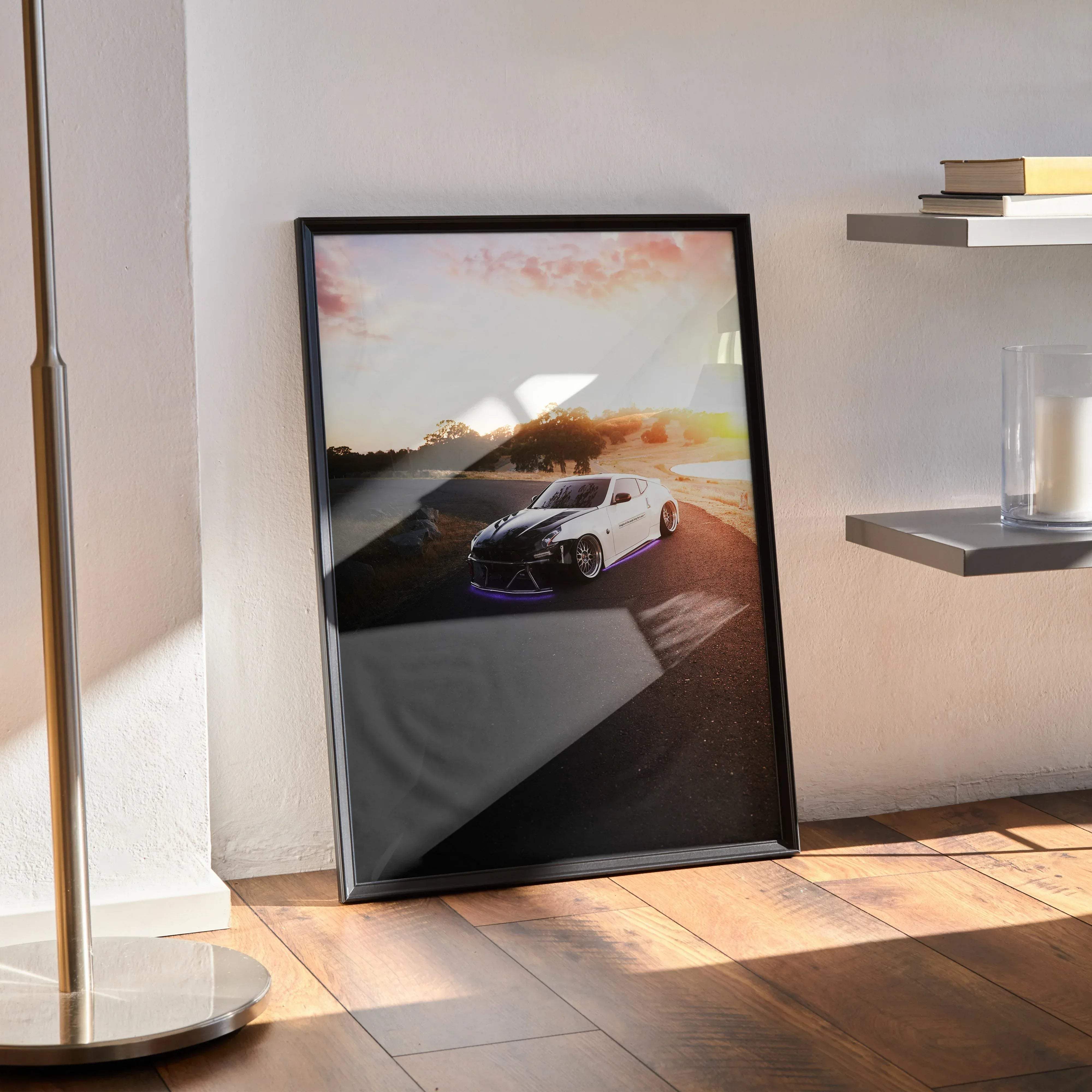Black-framed poster of a white nissan 370z with purple underglow driving on a sunlit road high resolution print