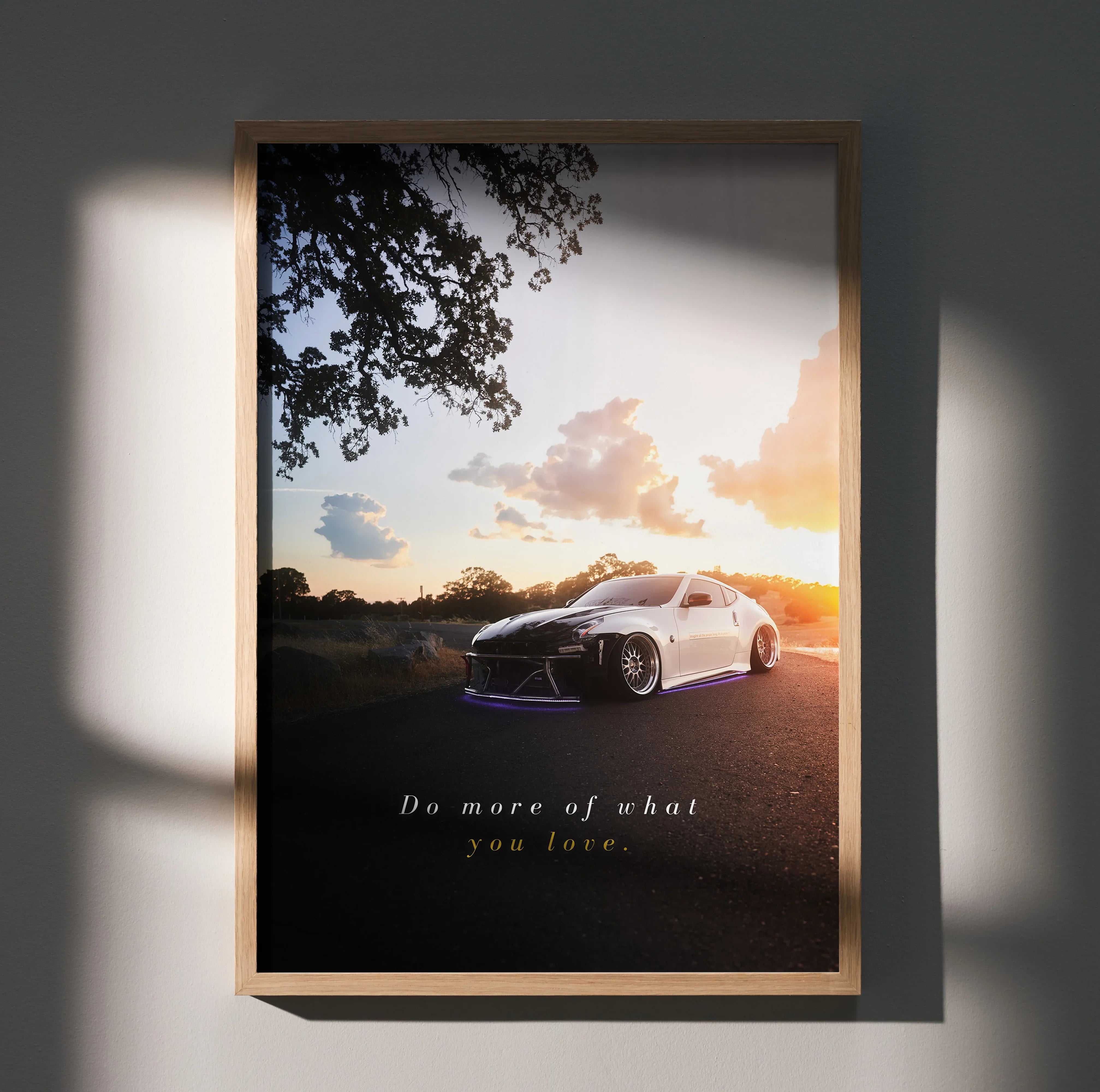 Motivational poster wall art featuring white Nissan 370z at sunset with inspiring text.