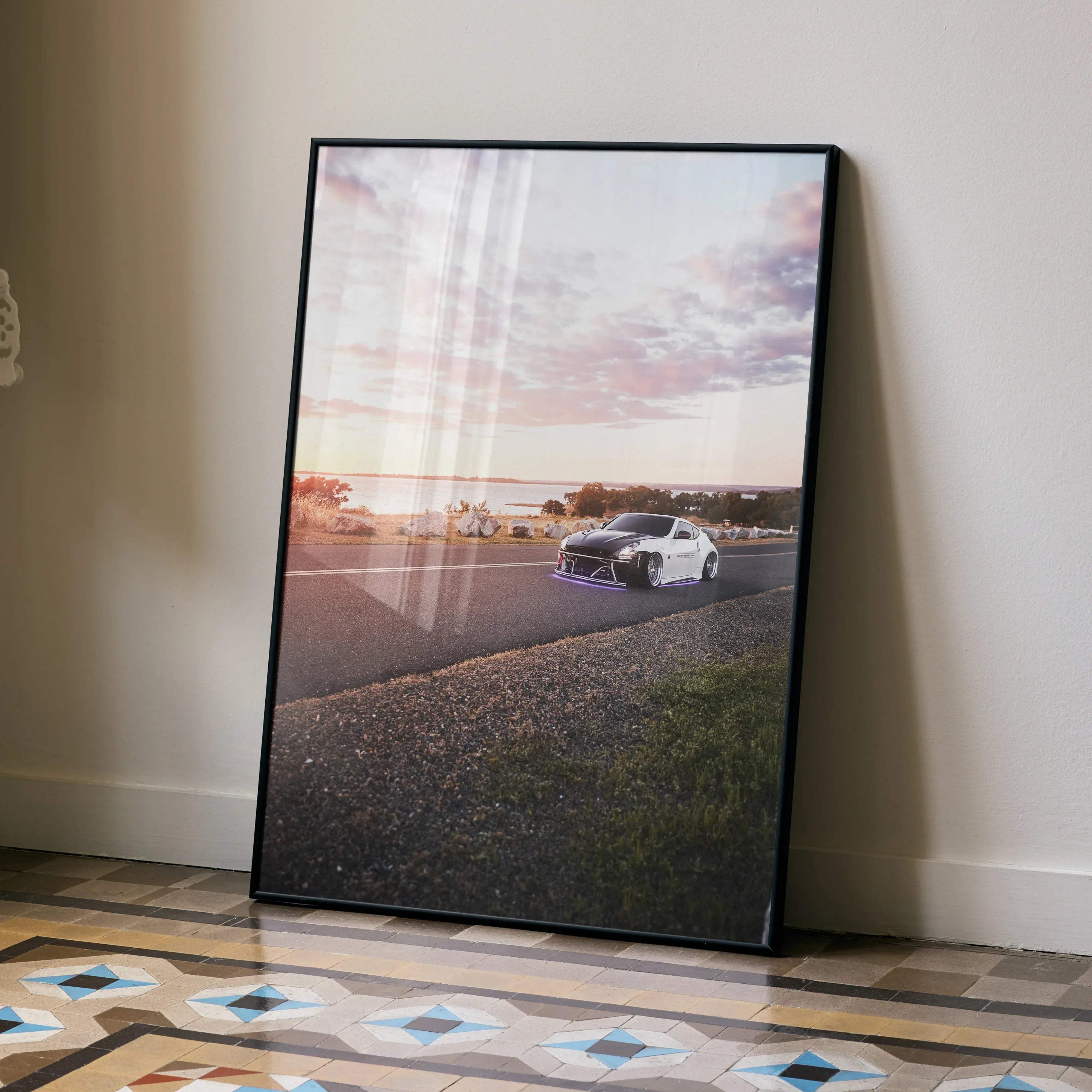 Black-framed Nissan 370z high resolution car poster featuring a white sports car with purple underglow at sunset