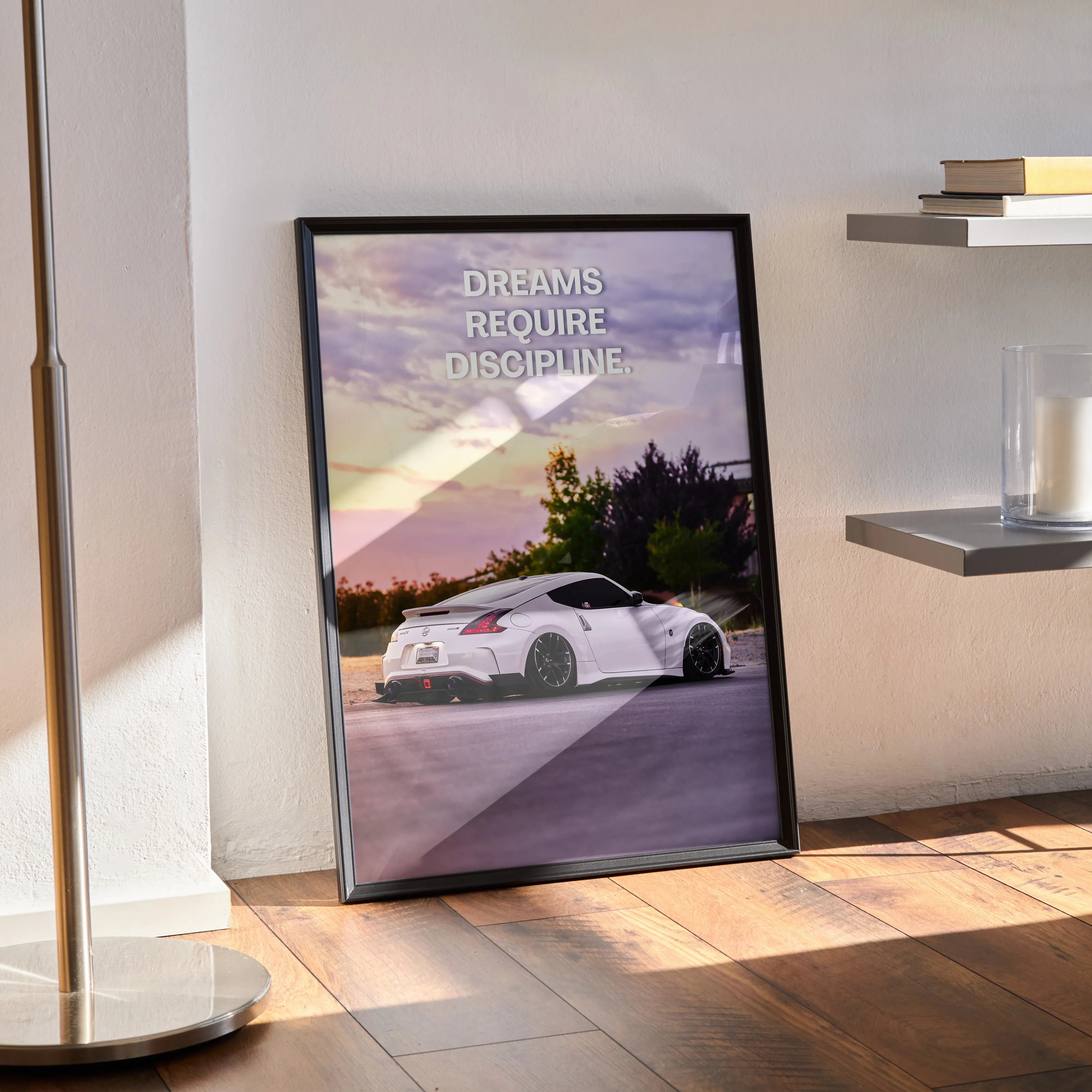 Framed motivational poster featuring a white Nissan 370z with inspiring quote, modern wall art.