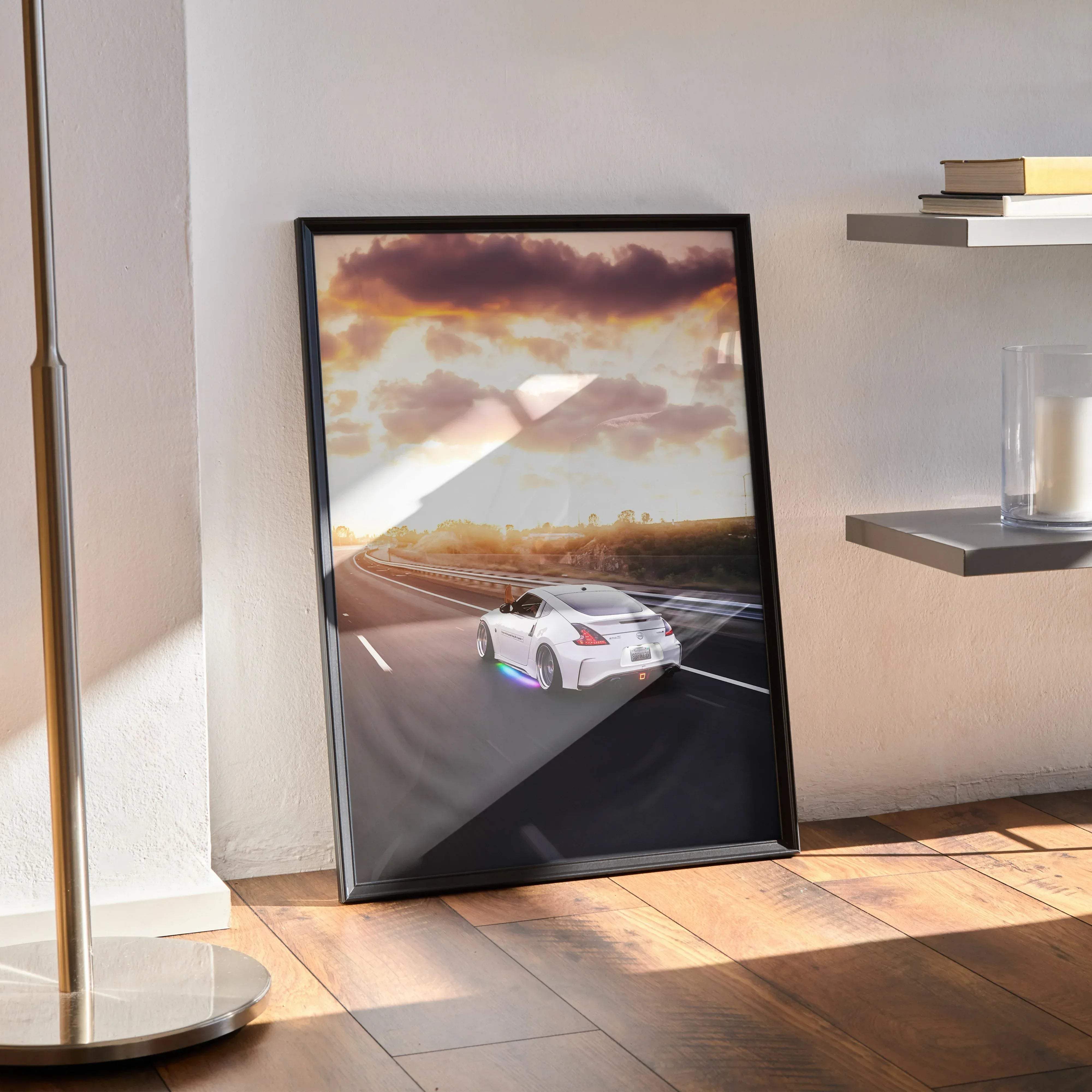 Black-framed nissan 370z high resolution car poster featuring a white sports car speeding under a colorful sky