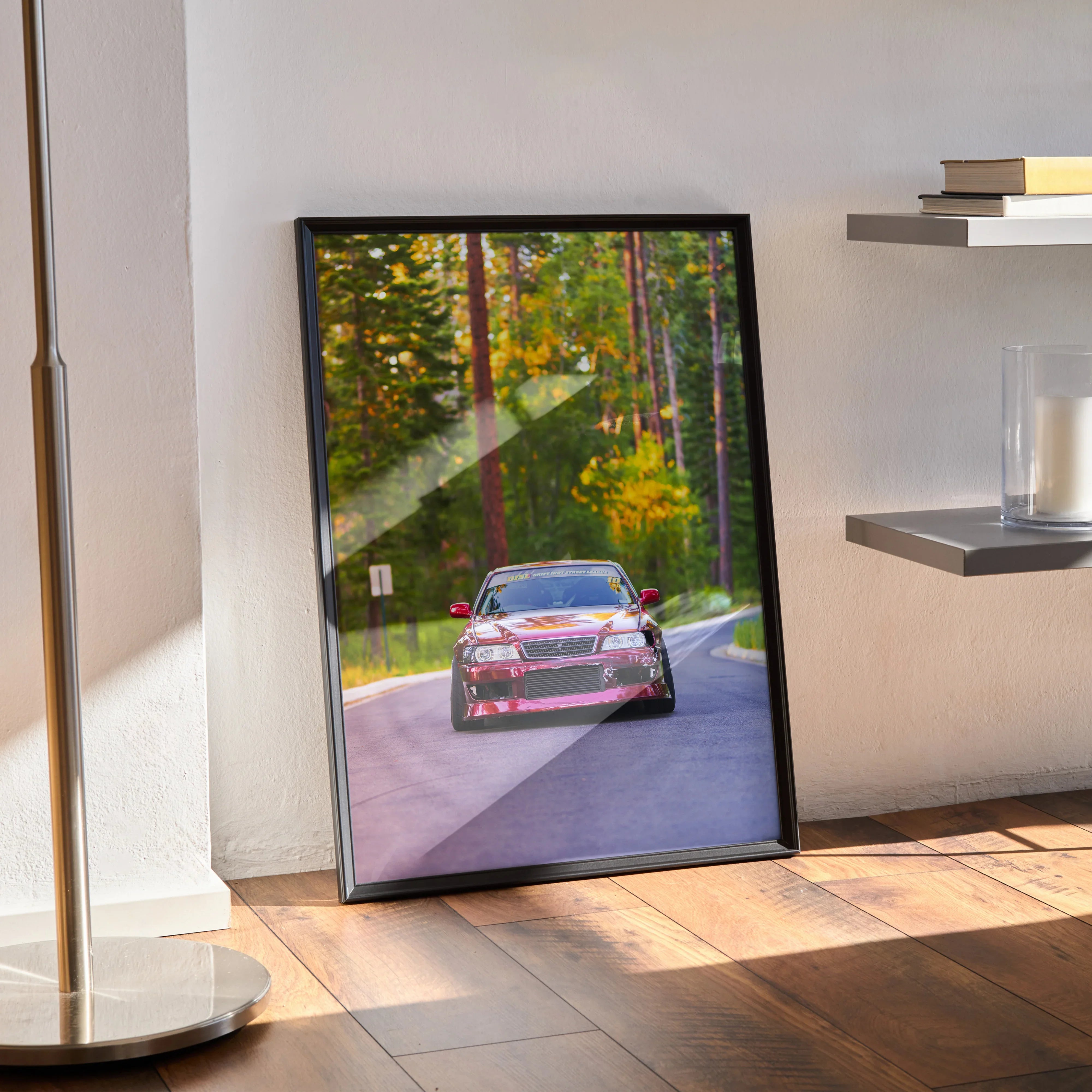 Toyota Chaser JDM drift car poster leaning against wall with forest road background wall art.