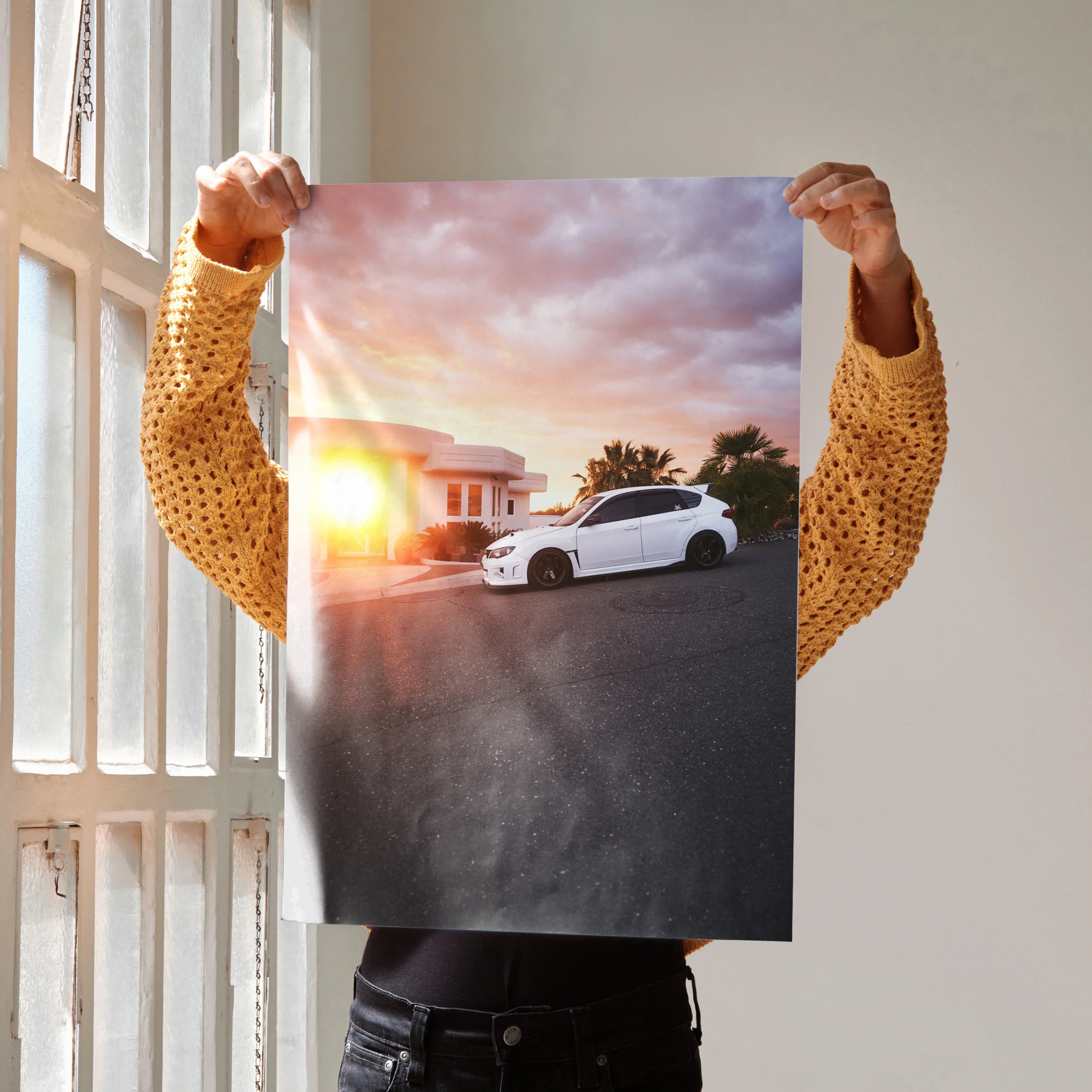 Subaru WRX STI poster featuring a white car at sunset, vibrant wall art for automotive fans.